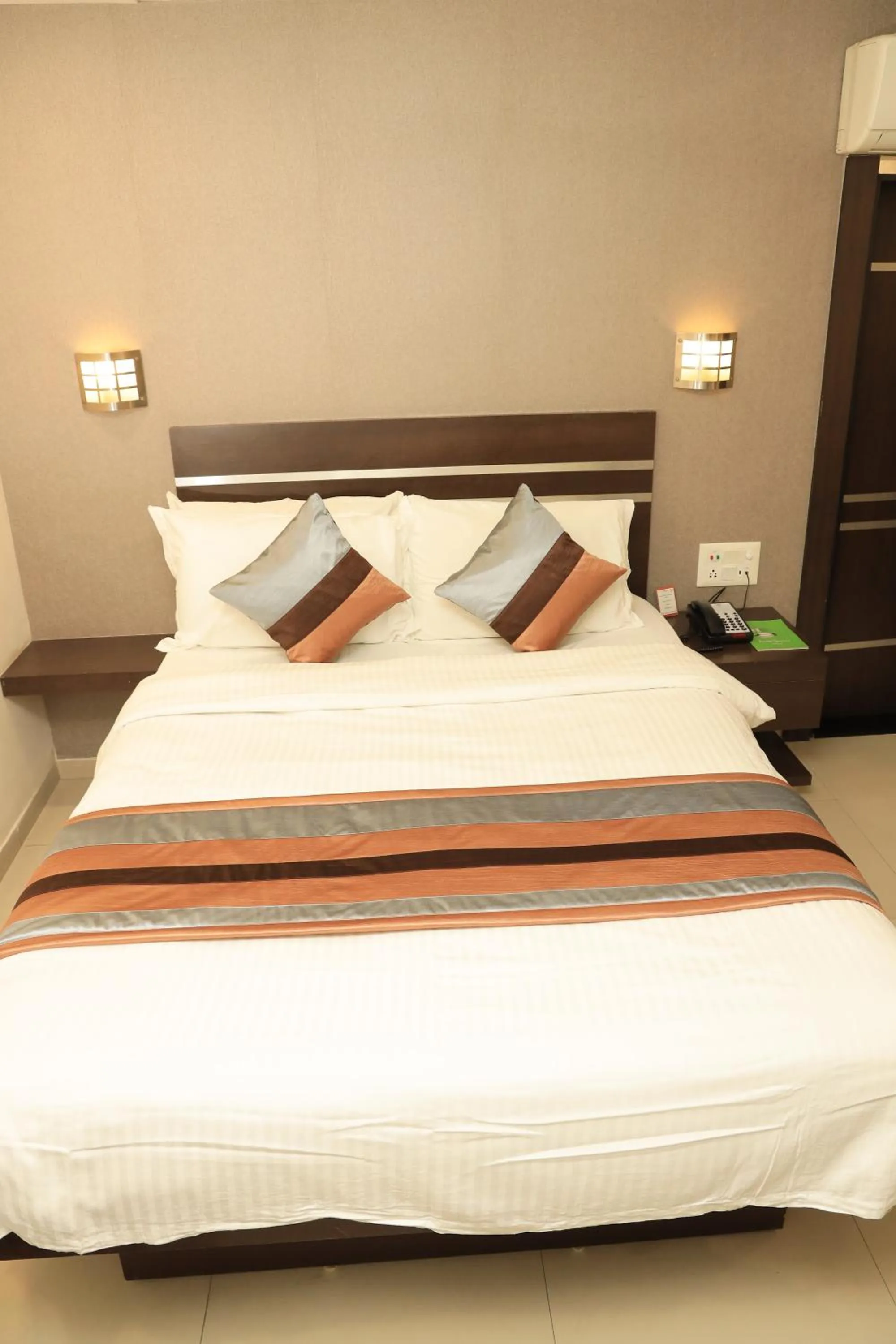 Bed in Click Hotel Yuvraj