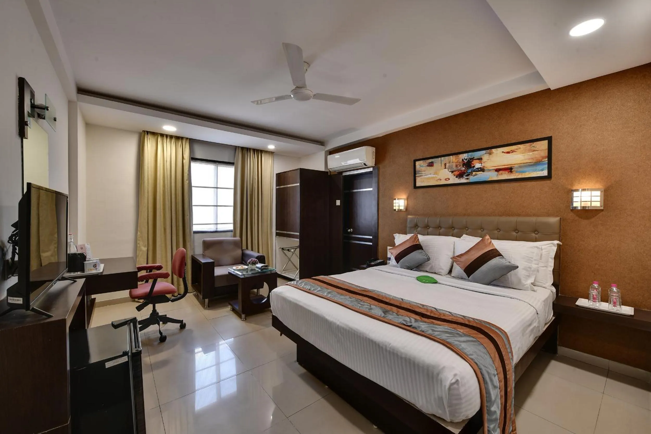 Bed in Click Hotel Yuvraj