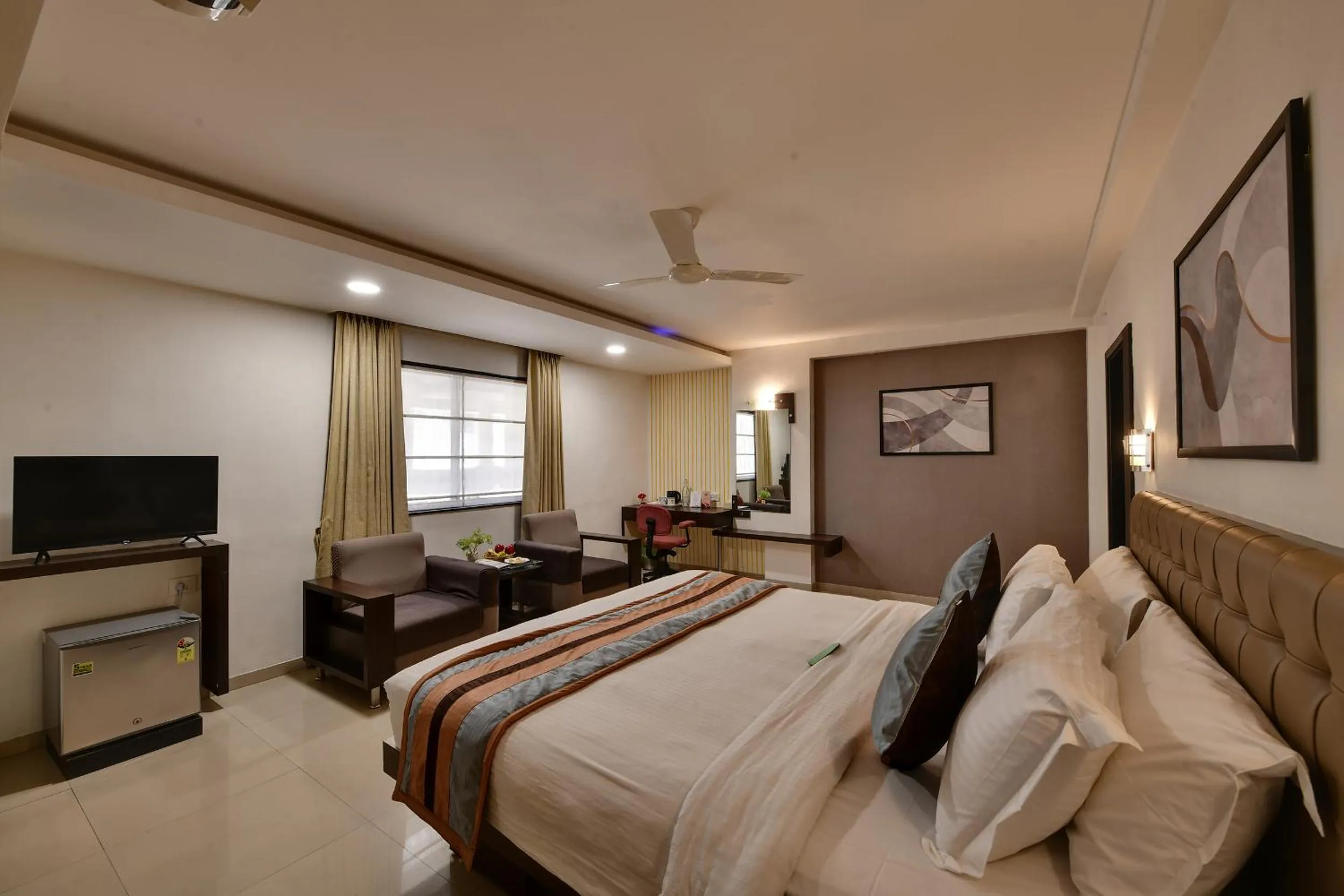 Bed in Click Hotel Yuvraj