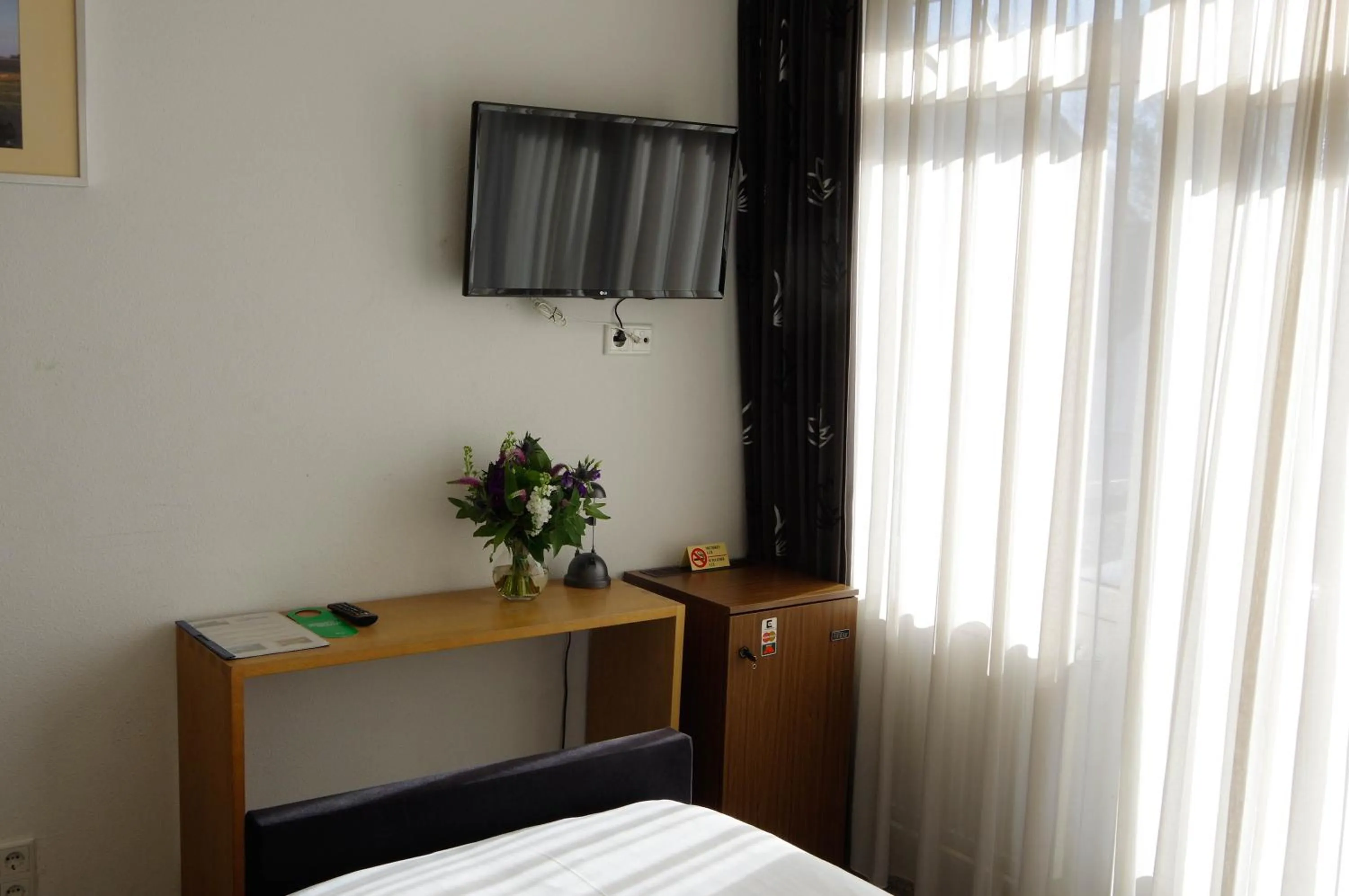 TV and multimedia, Bed in Hotel and Restaurant van Saaze