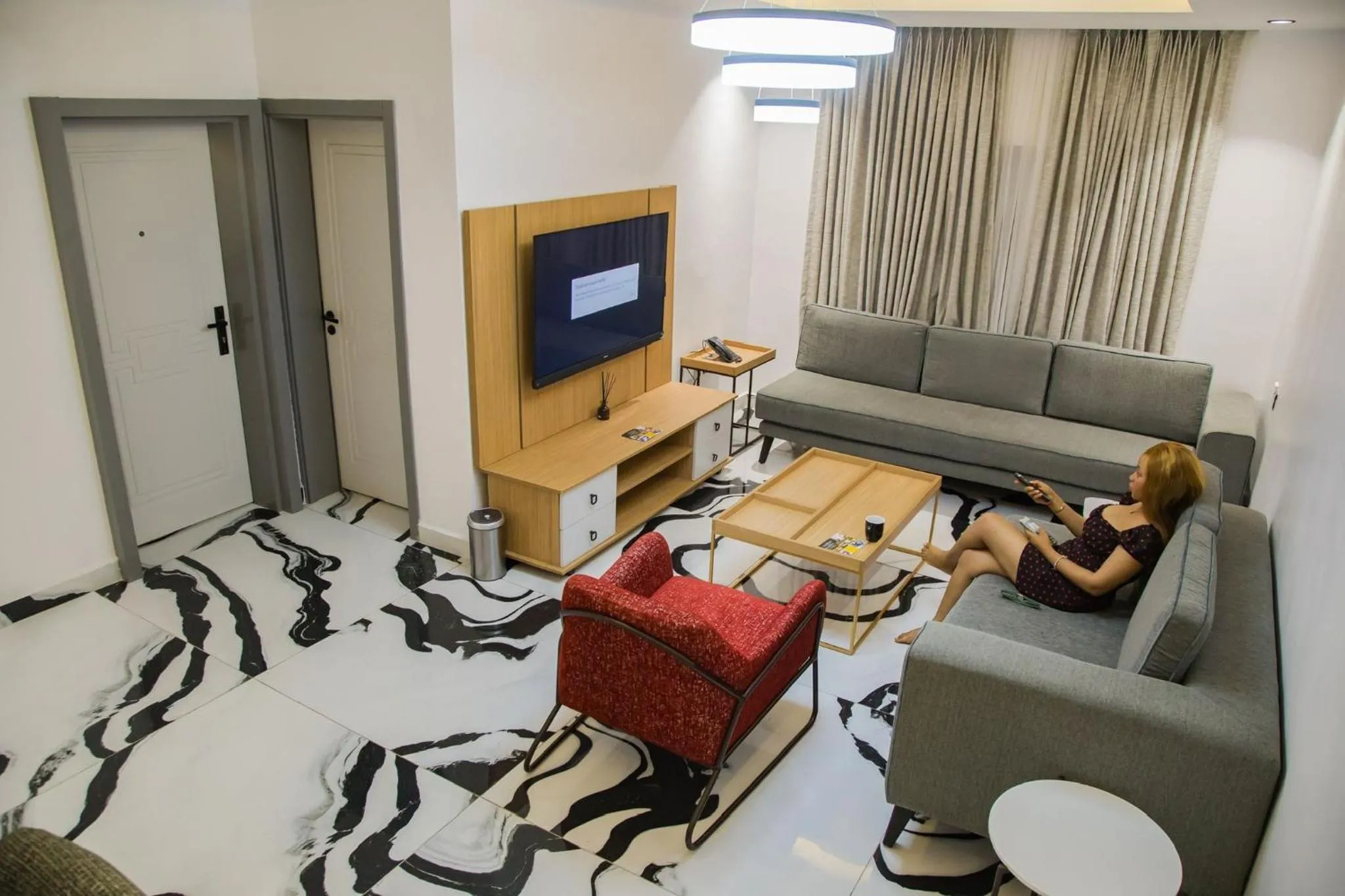 Communal lounge/ TV room in The Safron Hotel