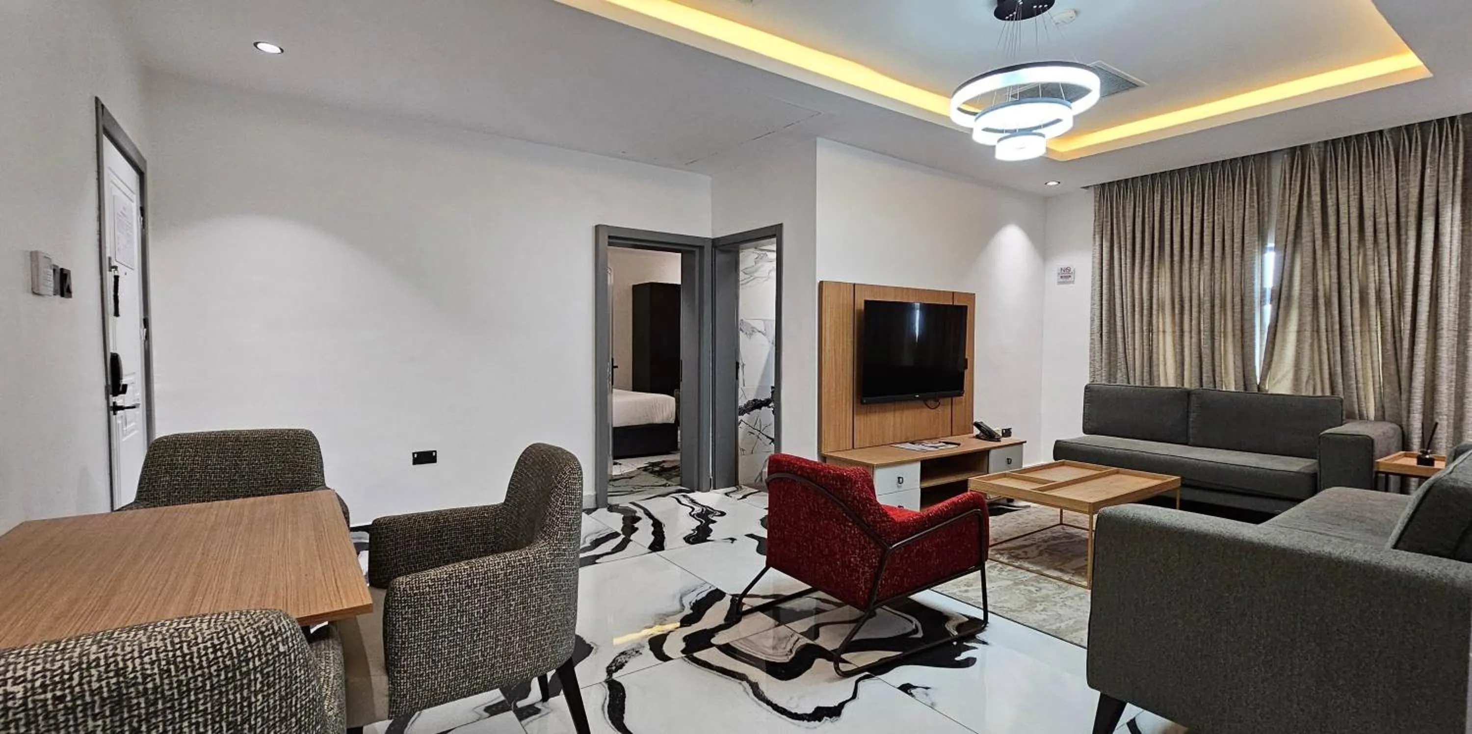 Communal lounge/ TV room in The Safron Hotel