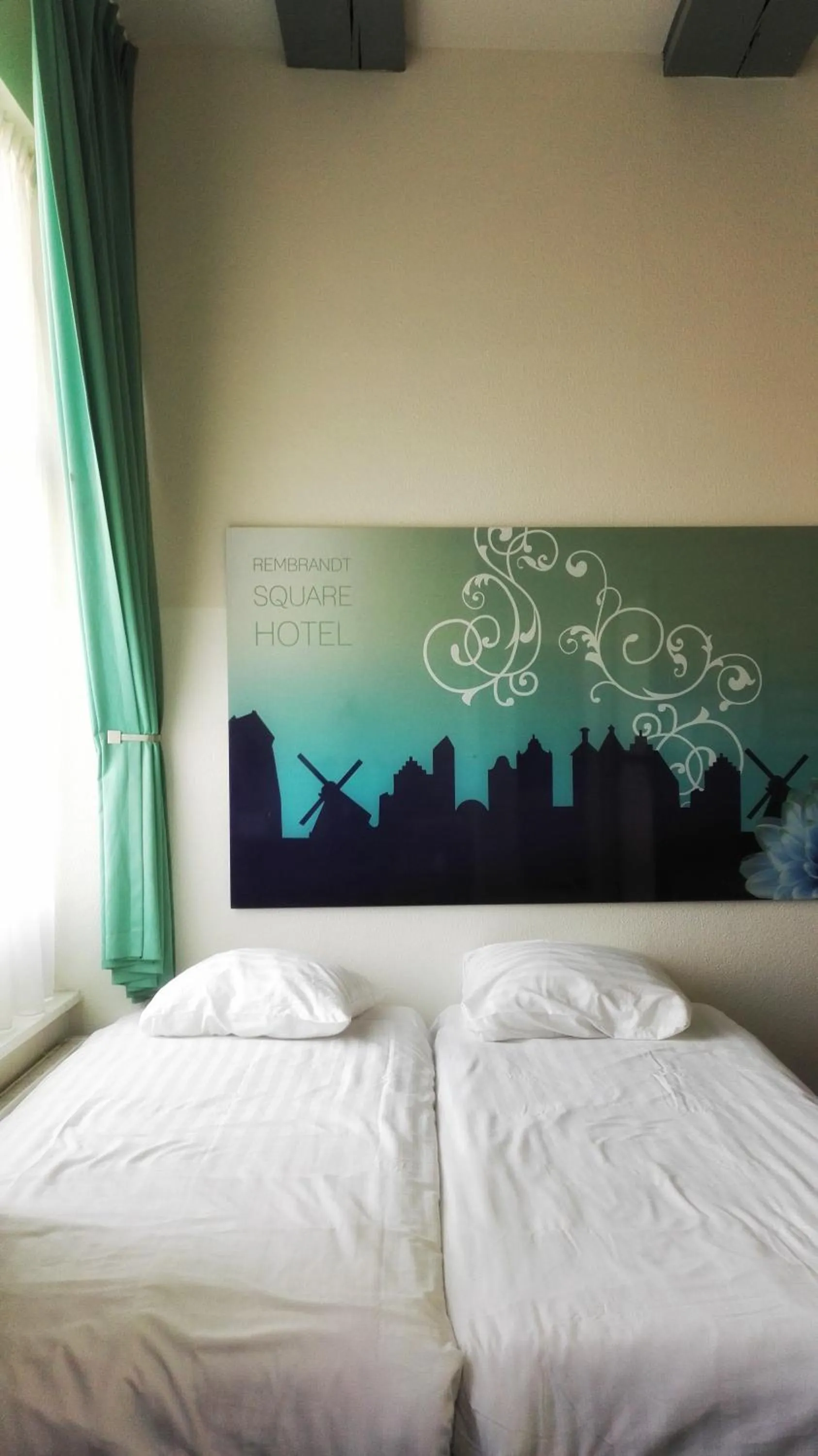 Bed in Rembrandt Square Hotel