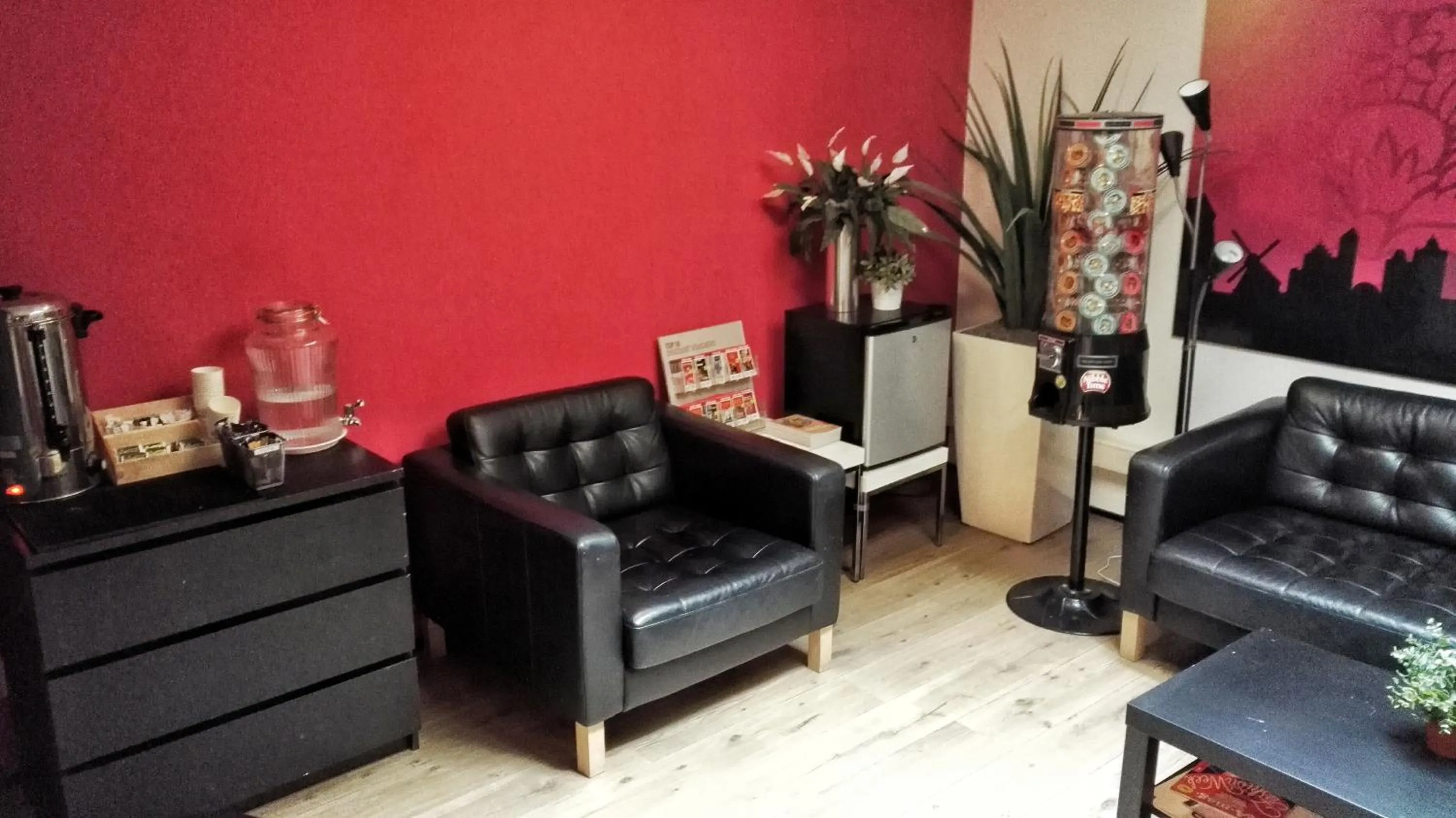 Communal lounge/ TV room in Rembrandt Square Hotel