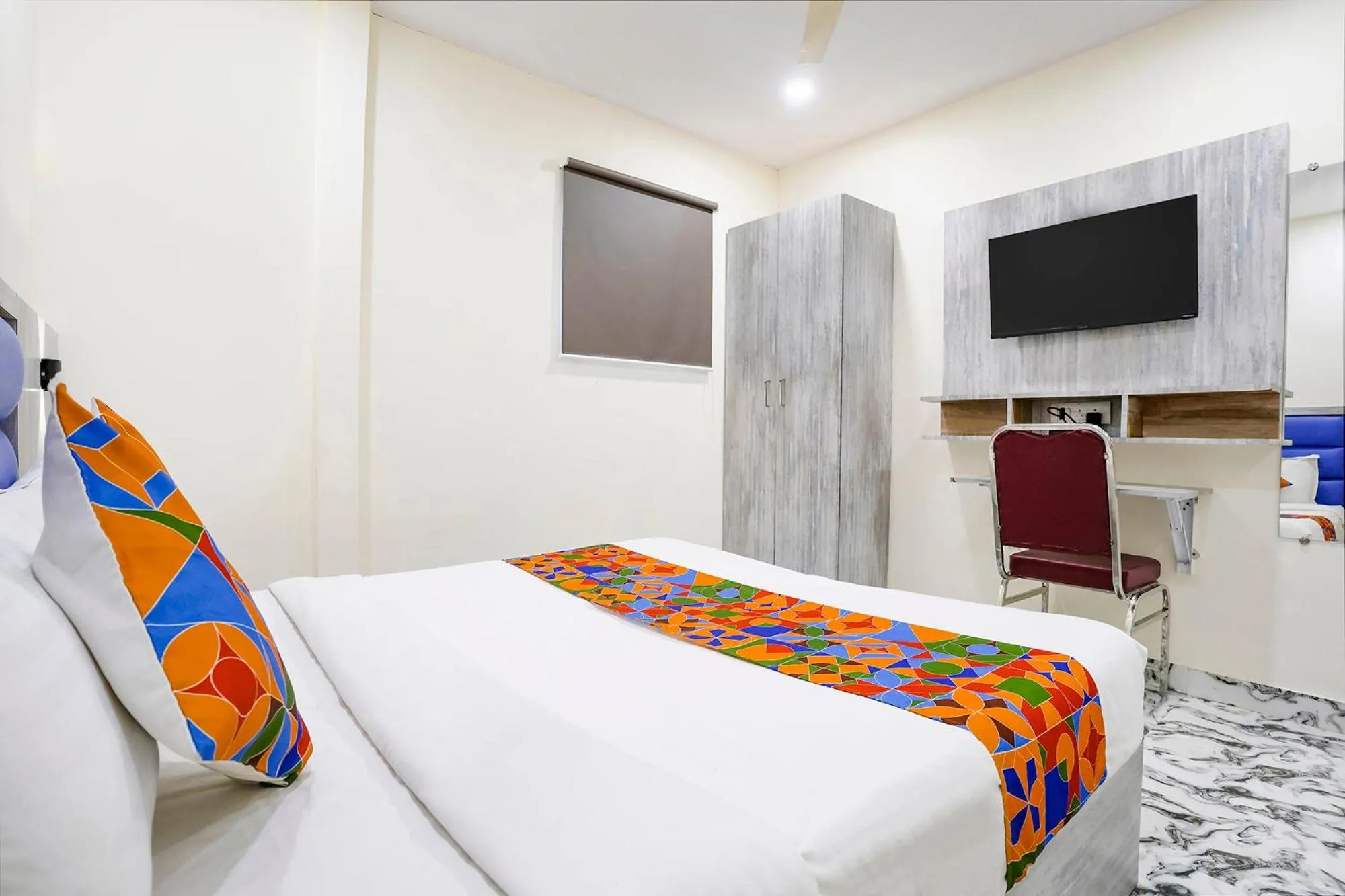 Bed in FabHotel Good Luck Residency