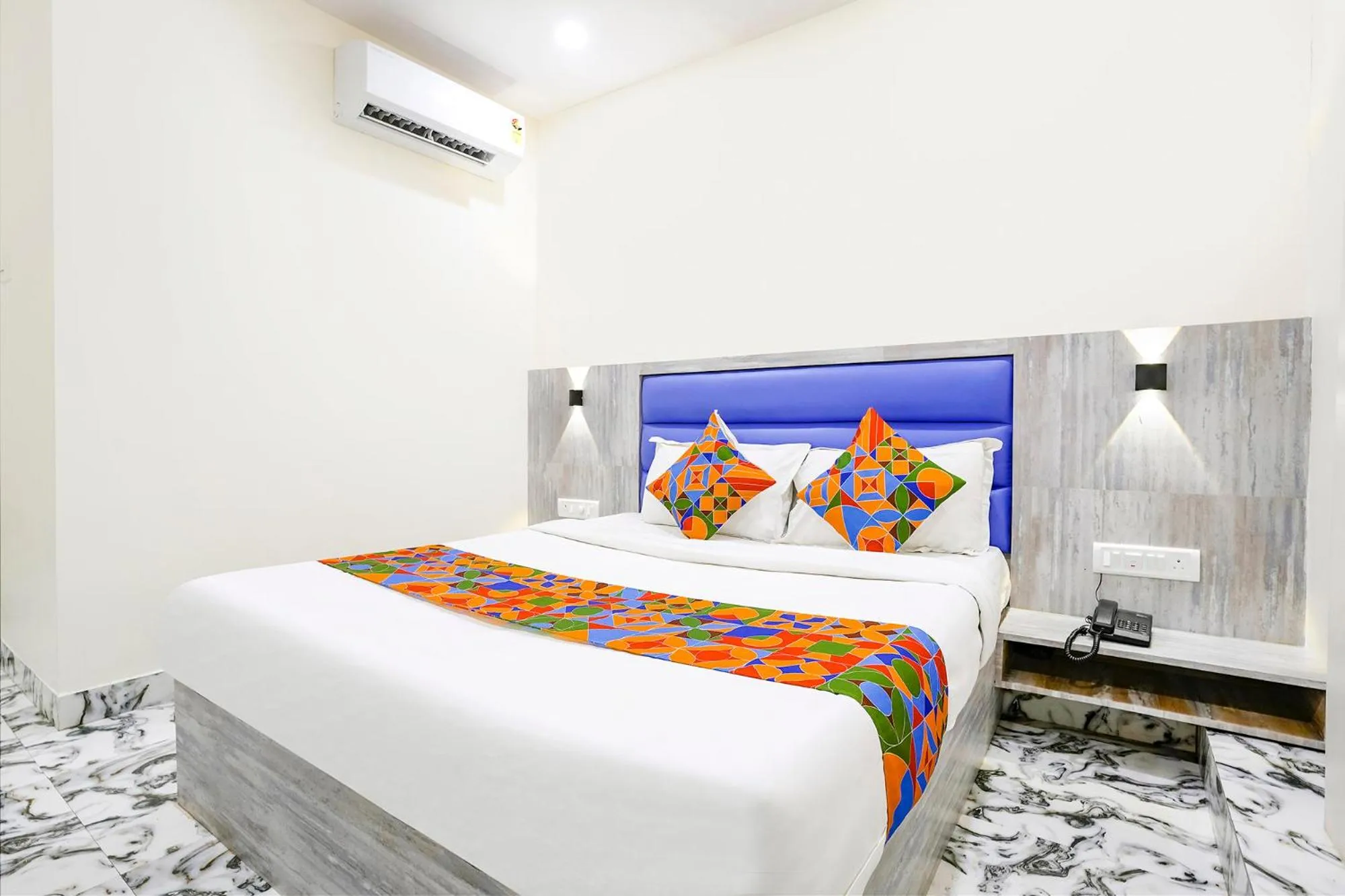 Bed in FabHotel Good Luck Residency