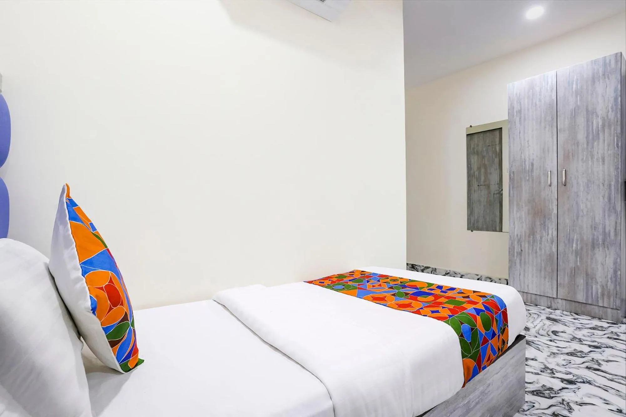 Bed in FabHotel Good Luck Residency