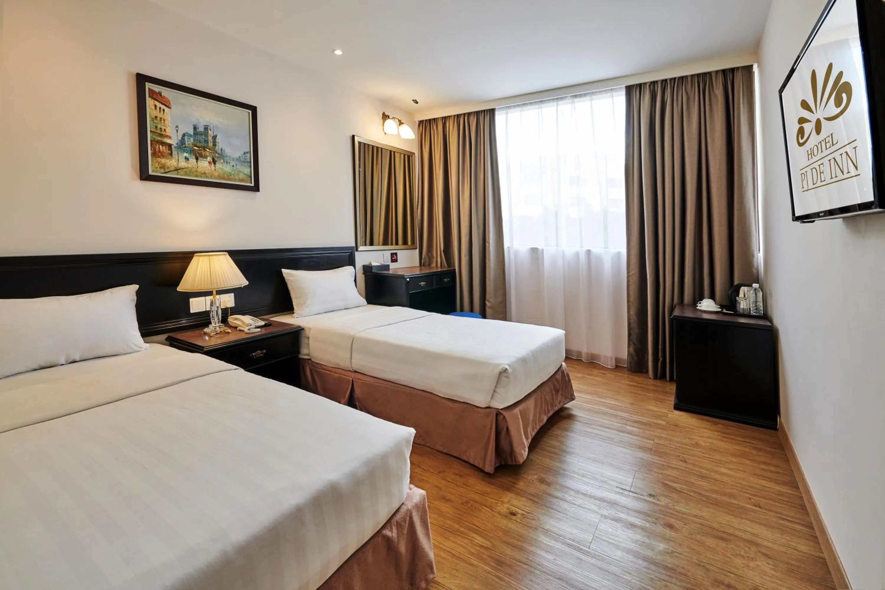 Bed in PJ De Inn Hotel