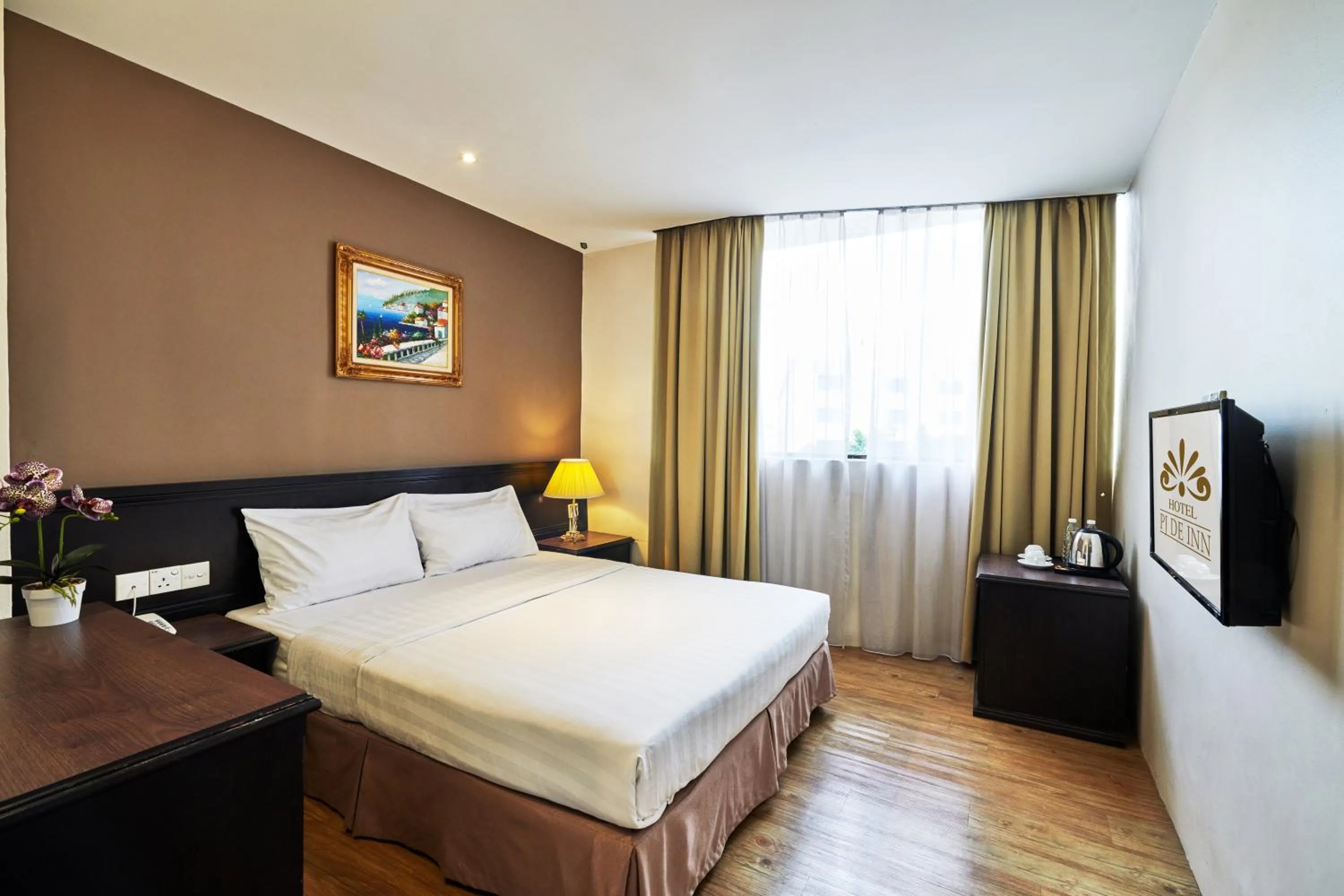 Bed in PJ De Inn Hotel