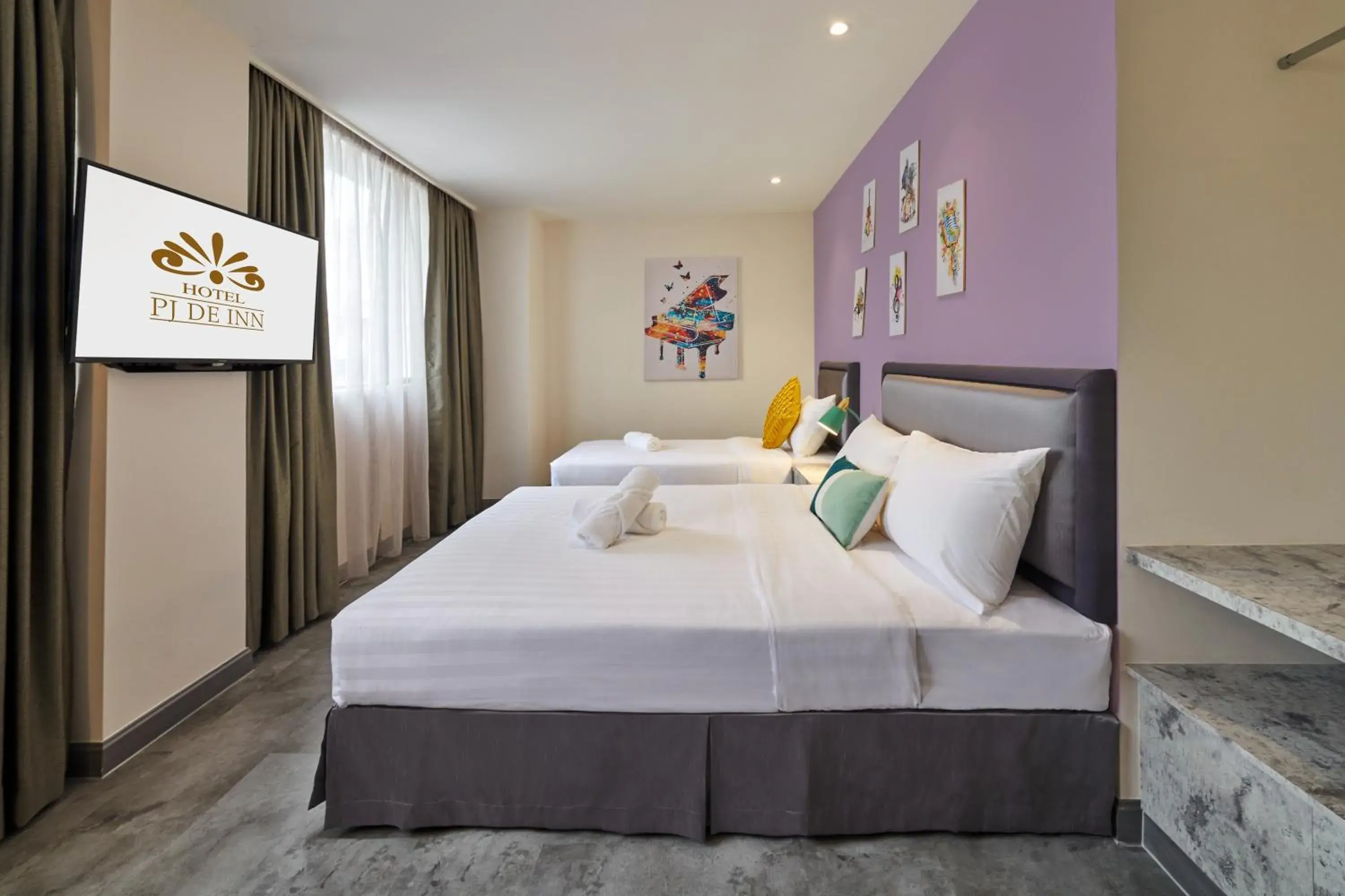 Bed in PJ De Inn Hotel Bed in PJ De Inn Hotel