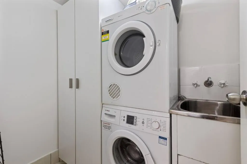 washing machine in Luxury on the Beach Surfside Resort -Sunshine Coast