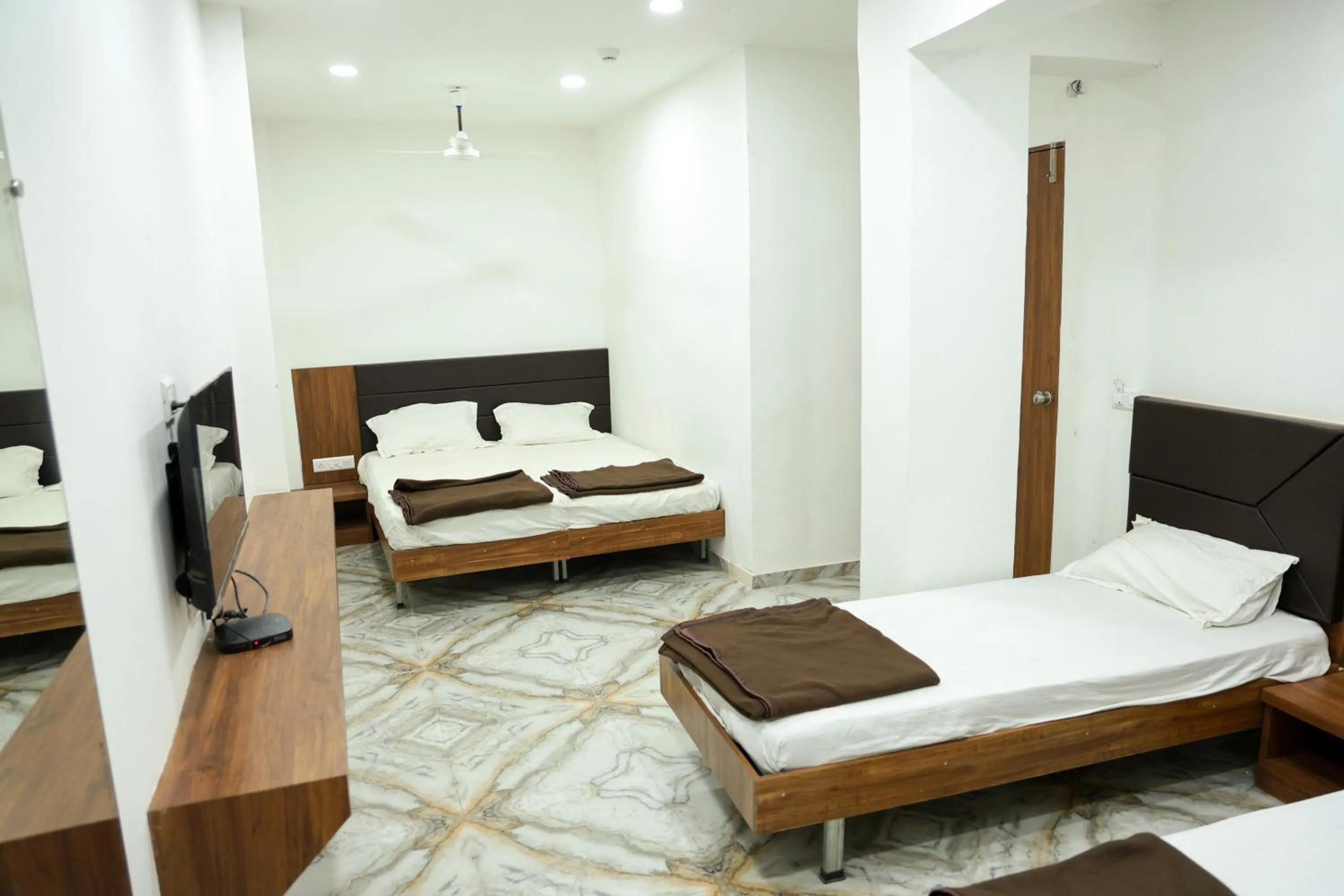 Bed in Hotel Aaram Kalupur
