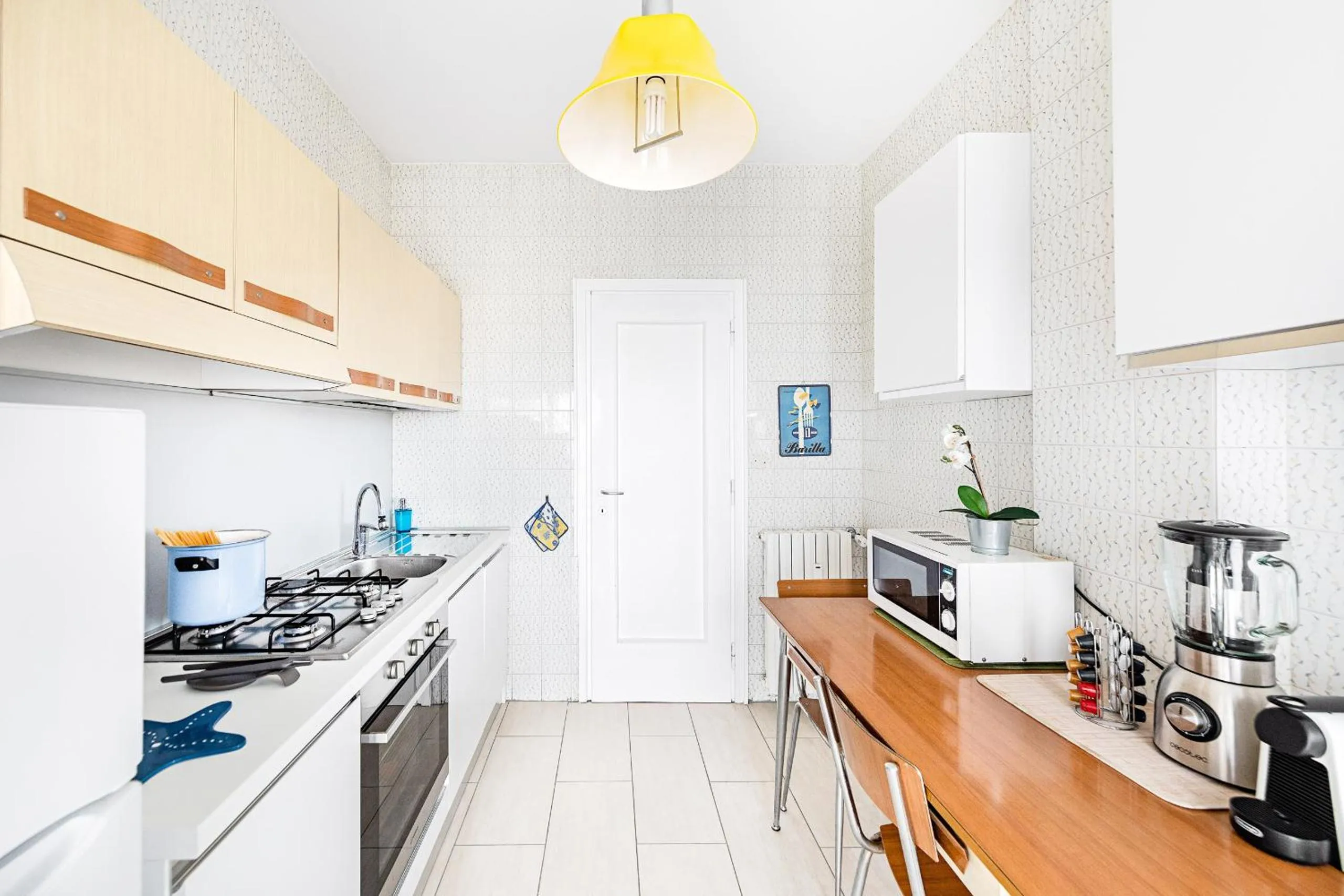 Kitchen or kitchenette in Le Orchidee 19 by Wonderful Italy