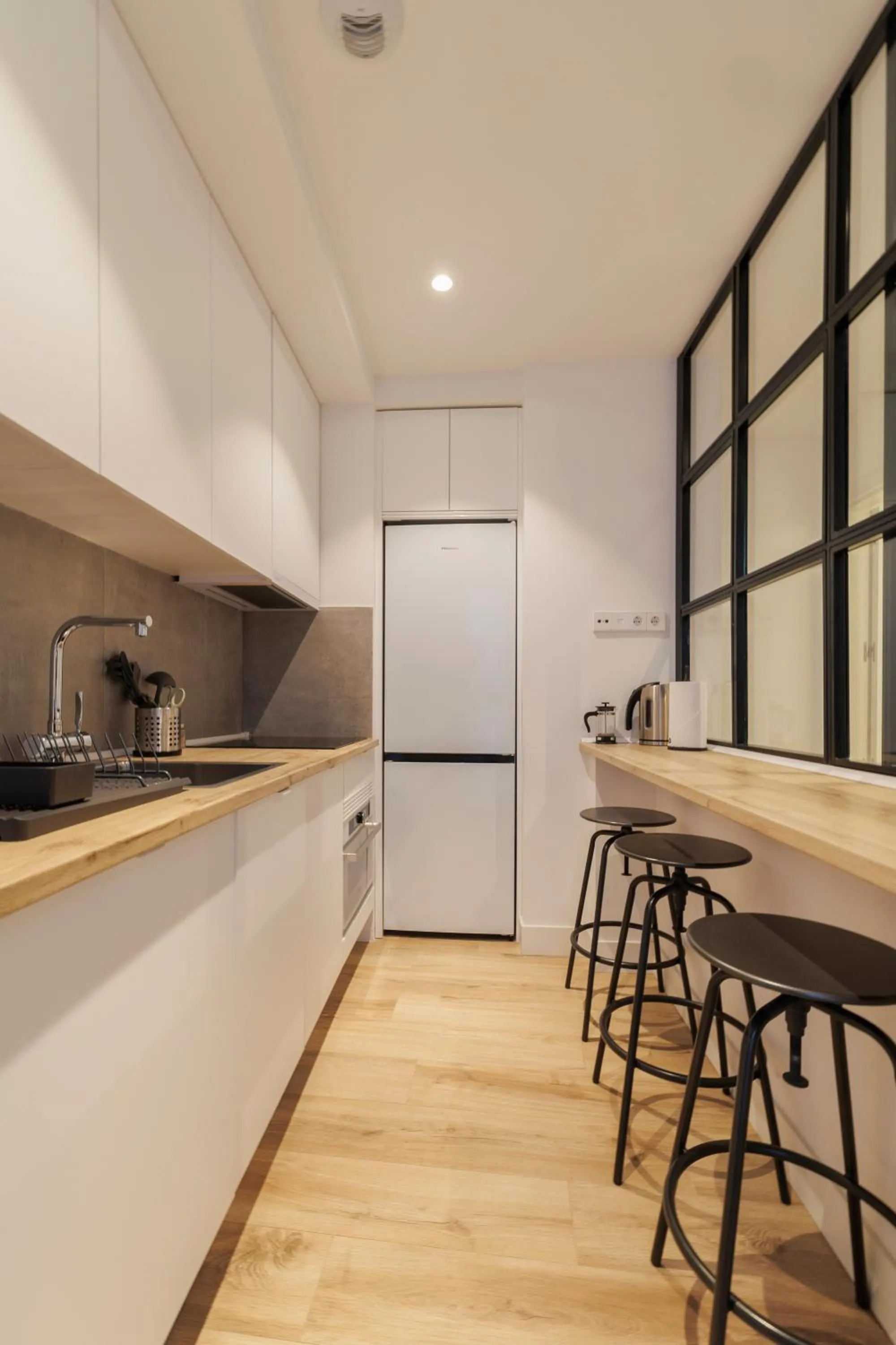 Kitchen or kitchenette in Fomento by Wynwood House
