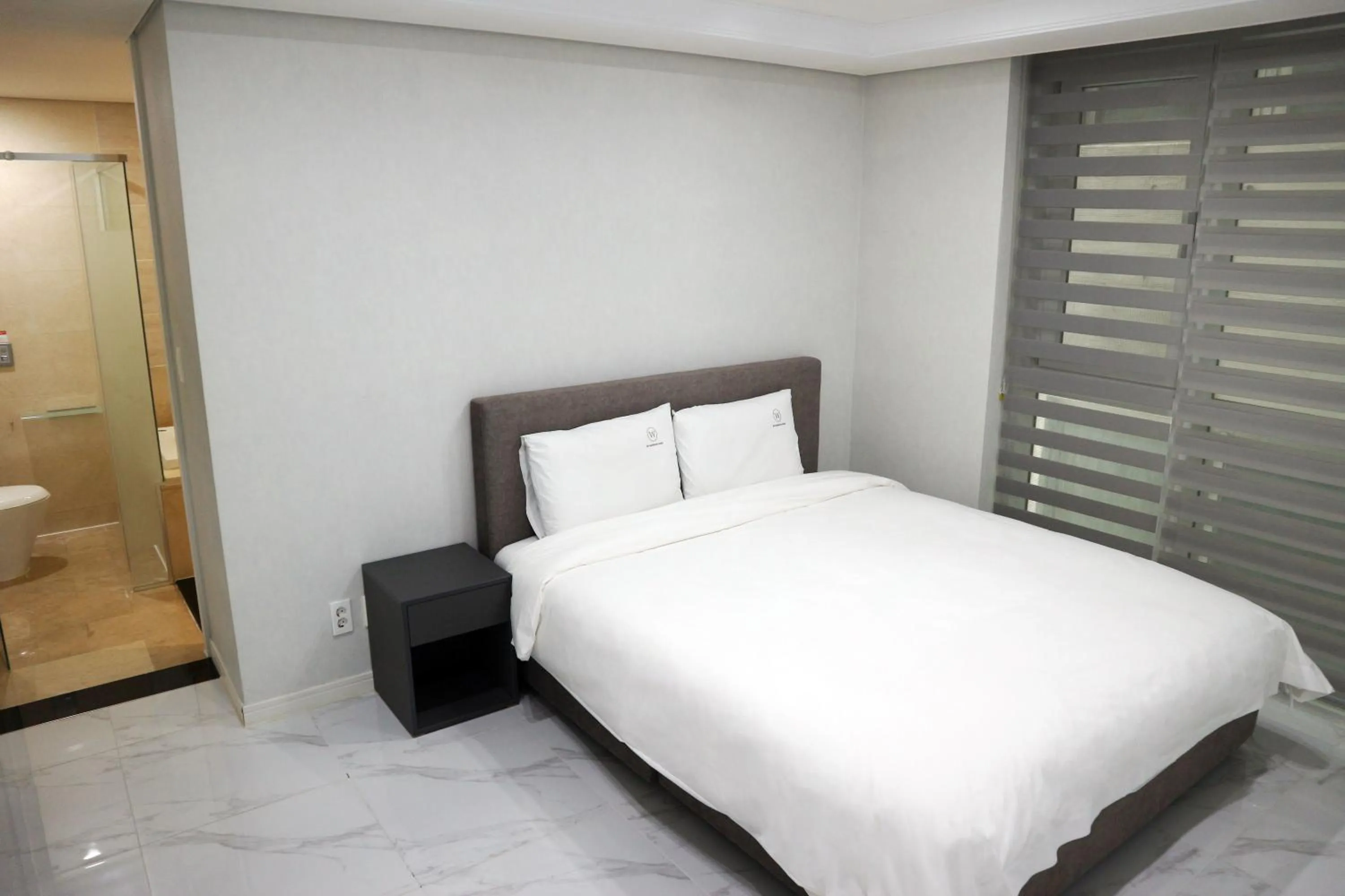 Bed in W Residence Hotel Centum City