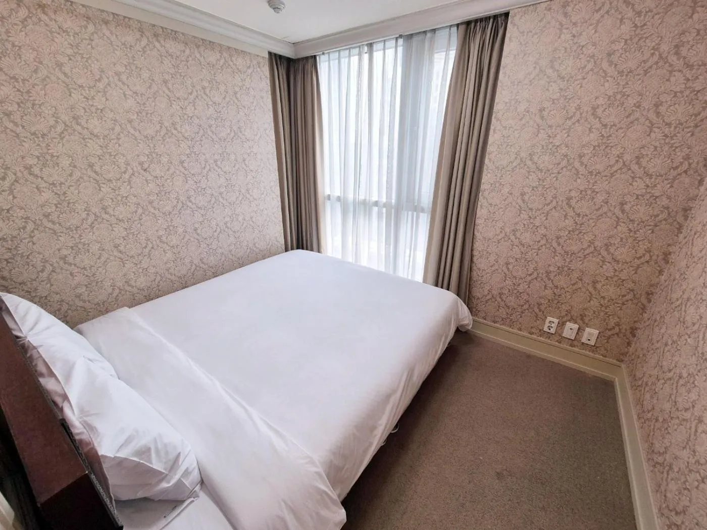 Bed in W Residence Hotel Centum City