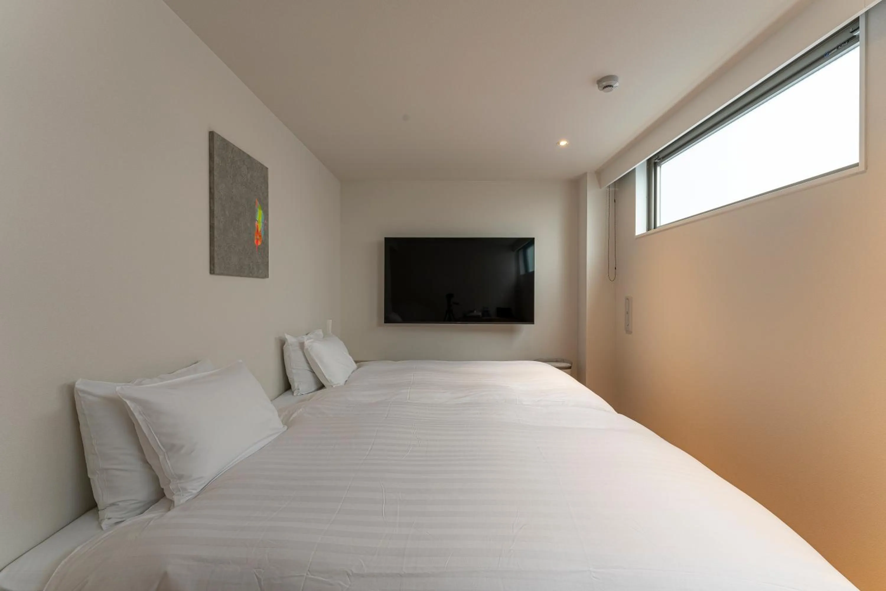 Bed in 9HOTEL Tenjin