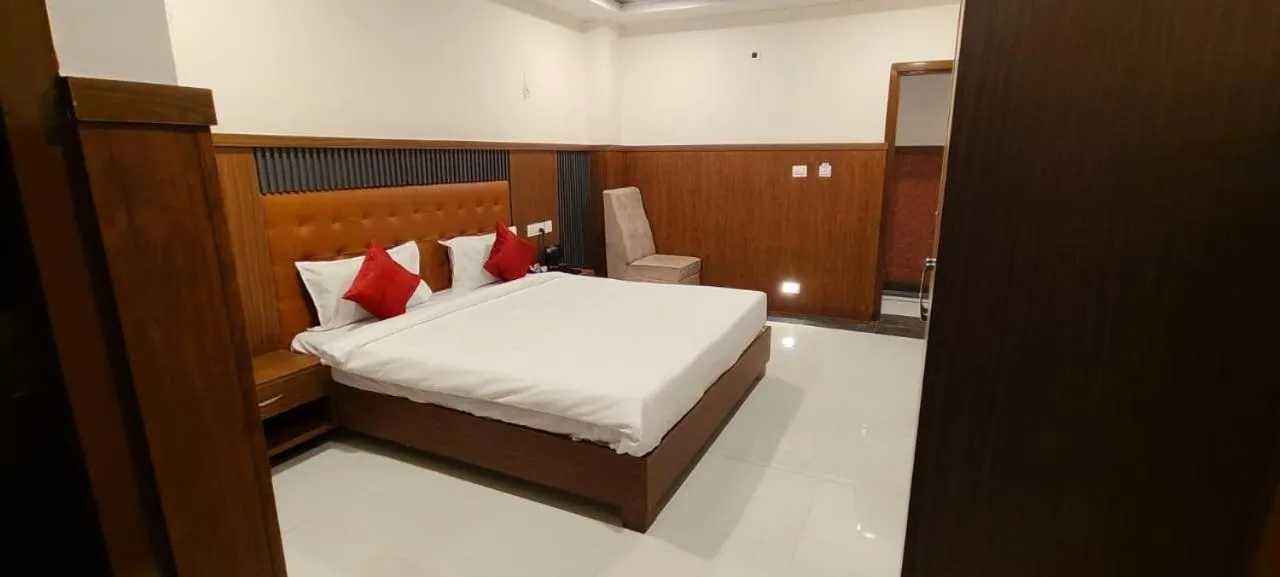 Bed in HOTEL GRAND ORCHID