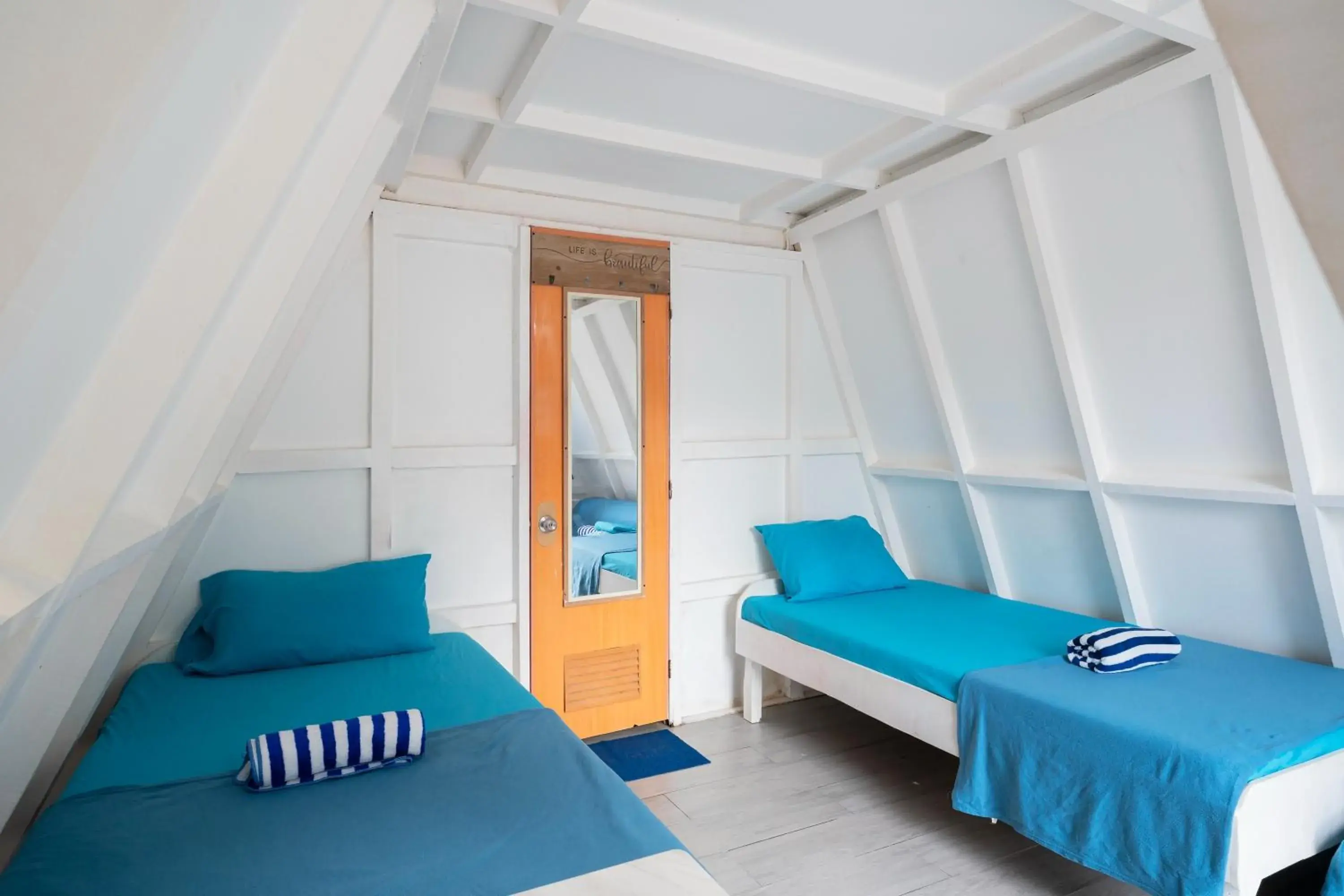 Bed in Costas De Liwa Bar & Beach Resort Bed in Costas De Liwa Bar & Beach Resort