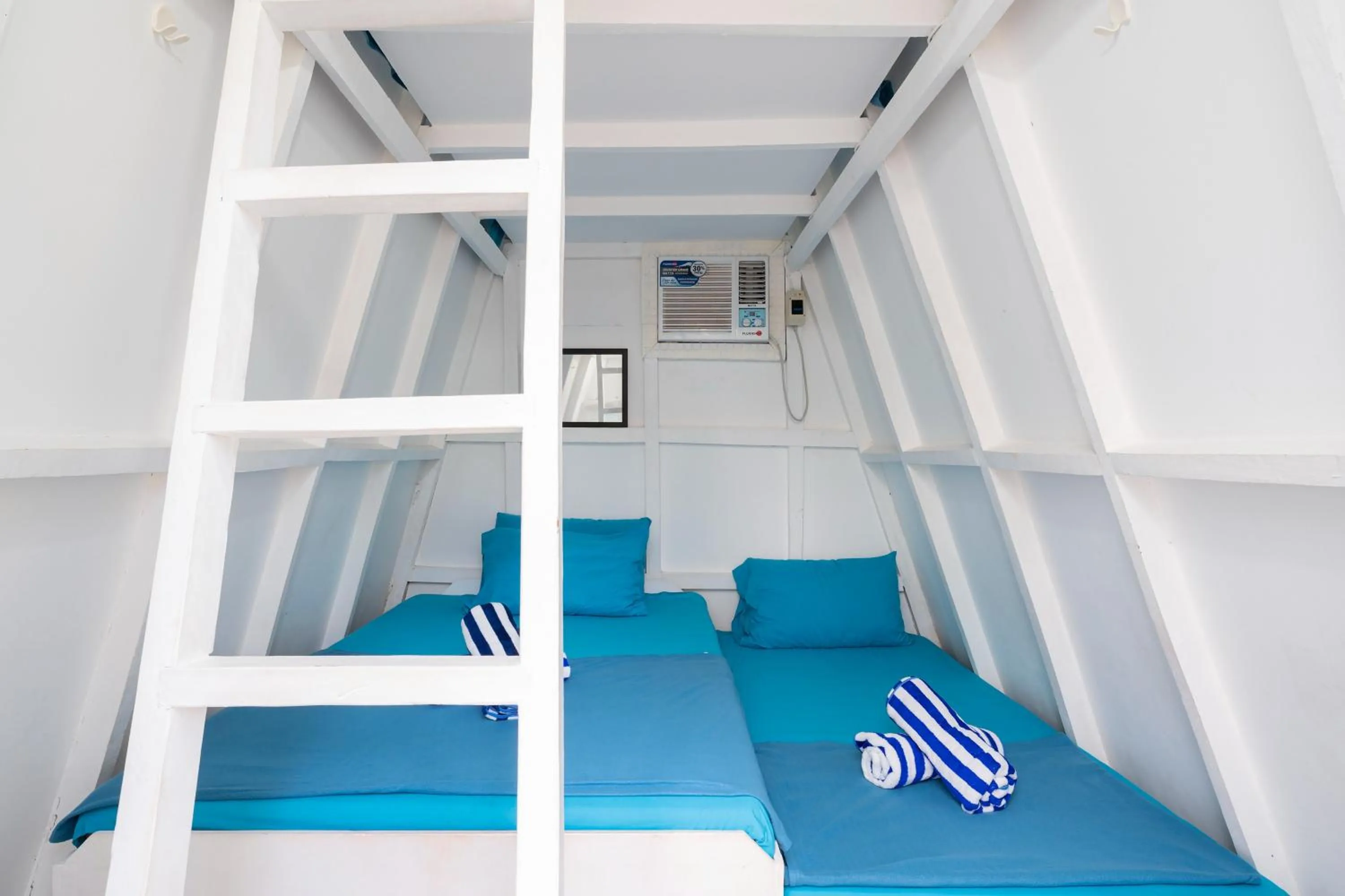 Bed in Costas De Liwa Bar & Beach Resort