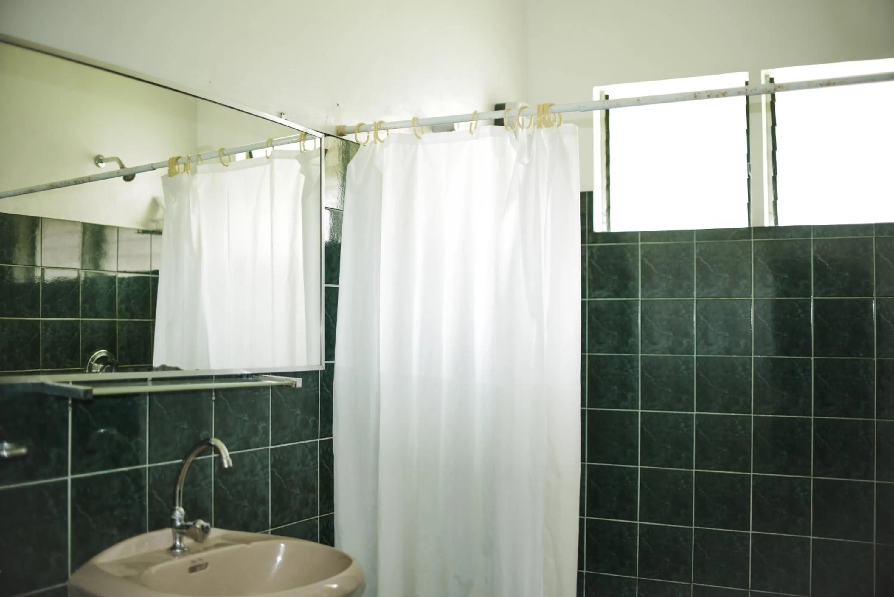 Bathroom in Whispering Palms Island Resort