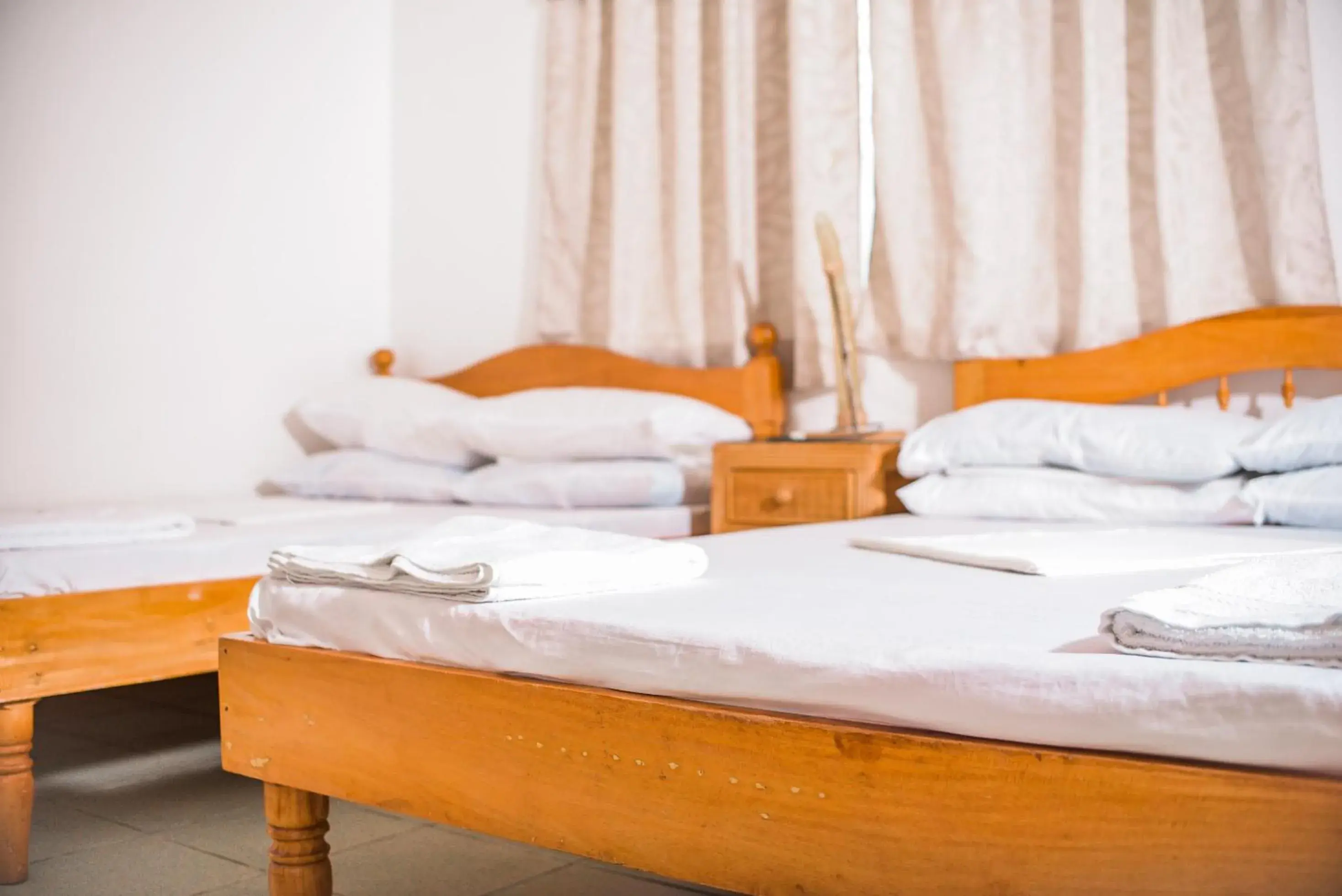 Bed in Whispering Palms Island Resort Bed in Whispering Palms Island Resort
