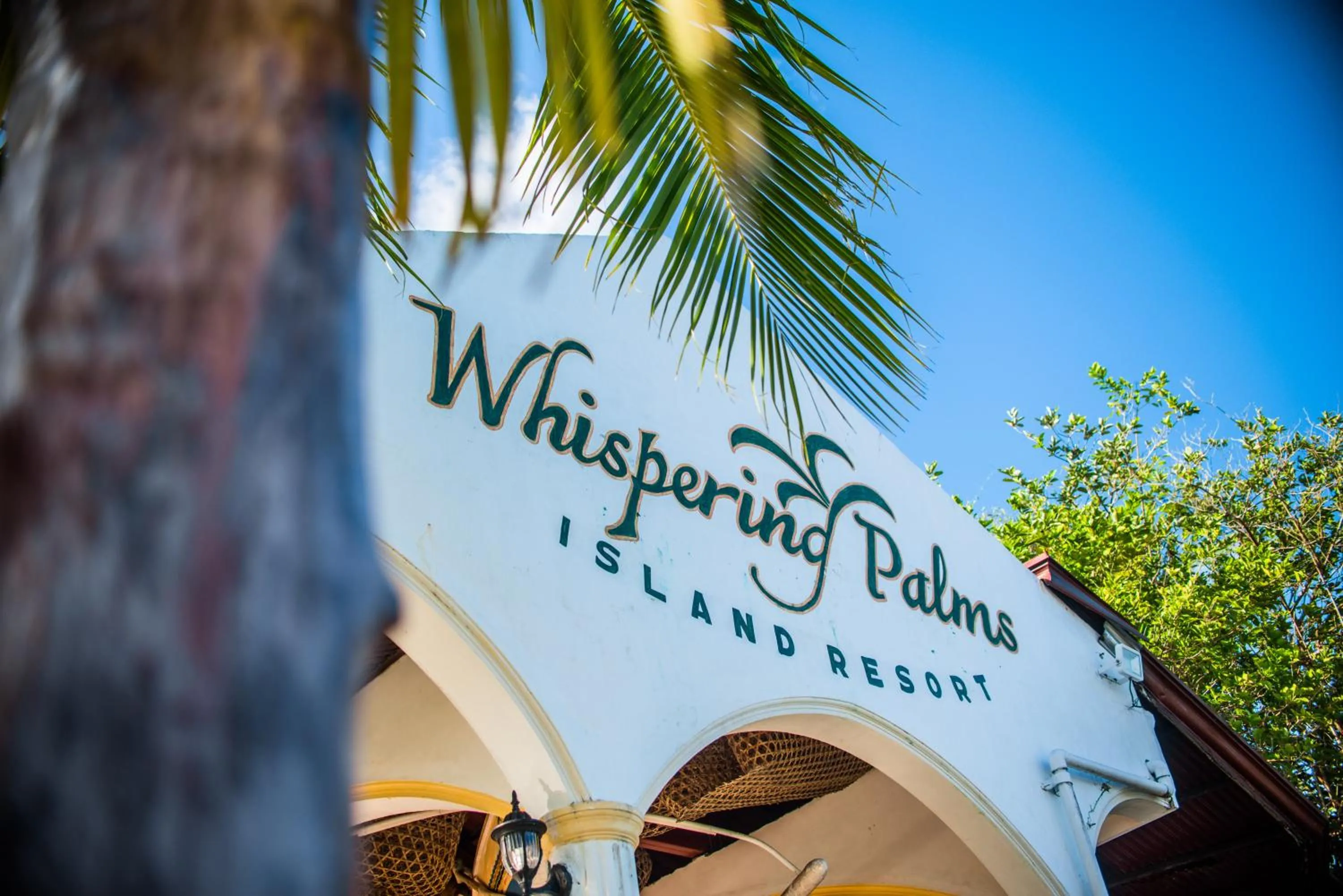 Property logo or sign in Whispering Palms Island Resort