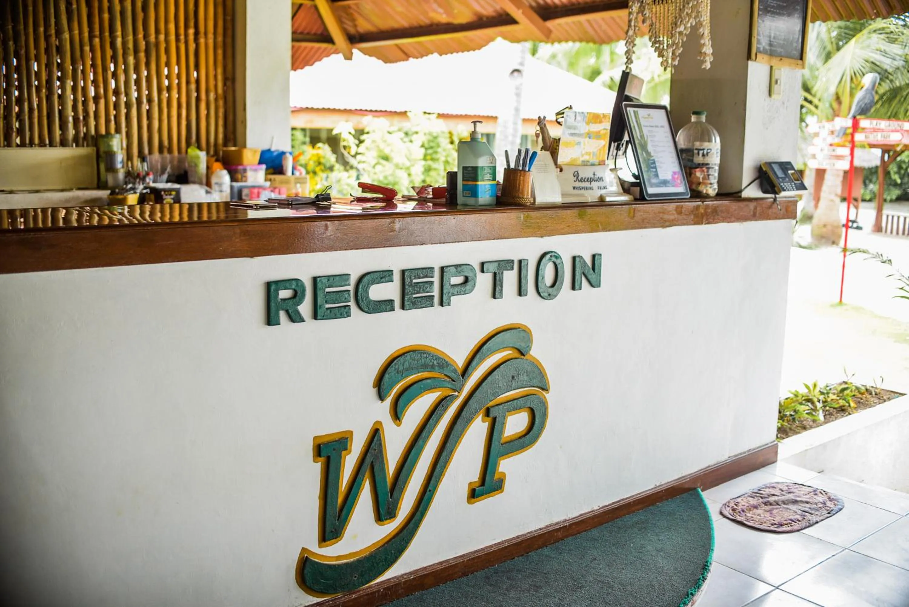 Property logo or sign in Whispering Palms Island Resort