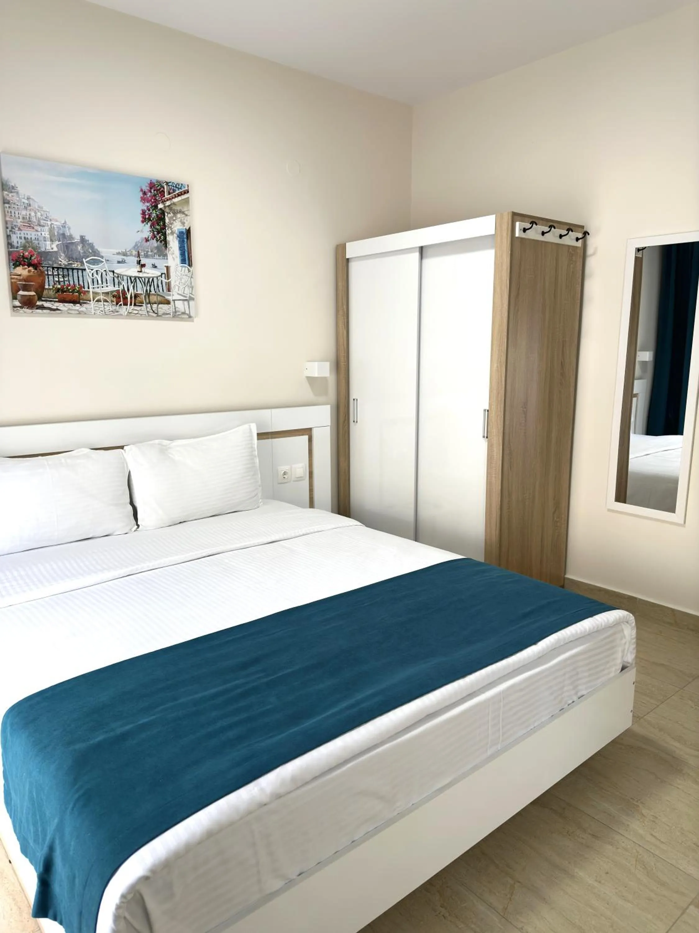 Bed in Navarino Luxe Suites