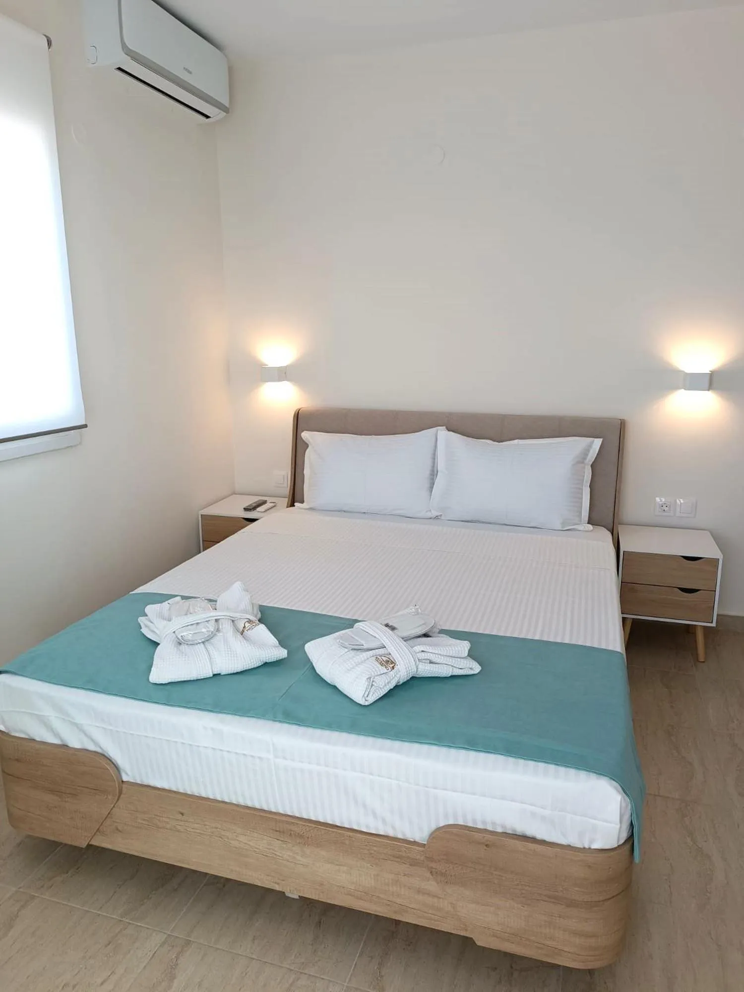 Bed in Navarino Luxe Suites