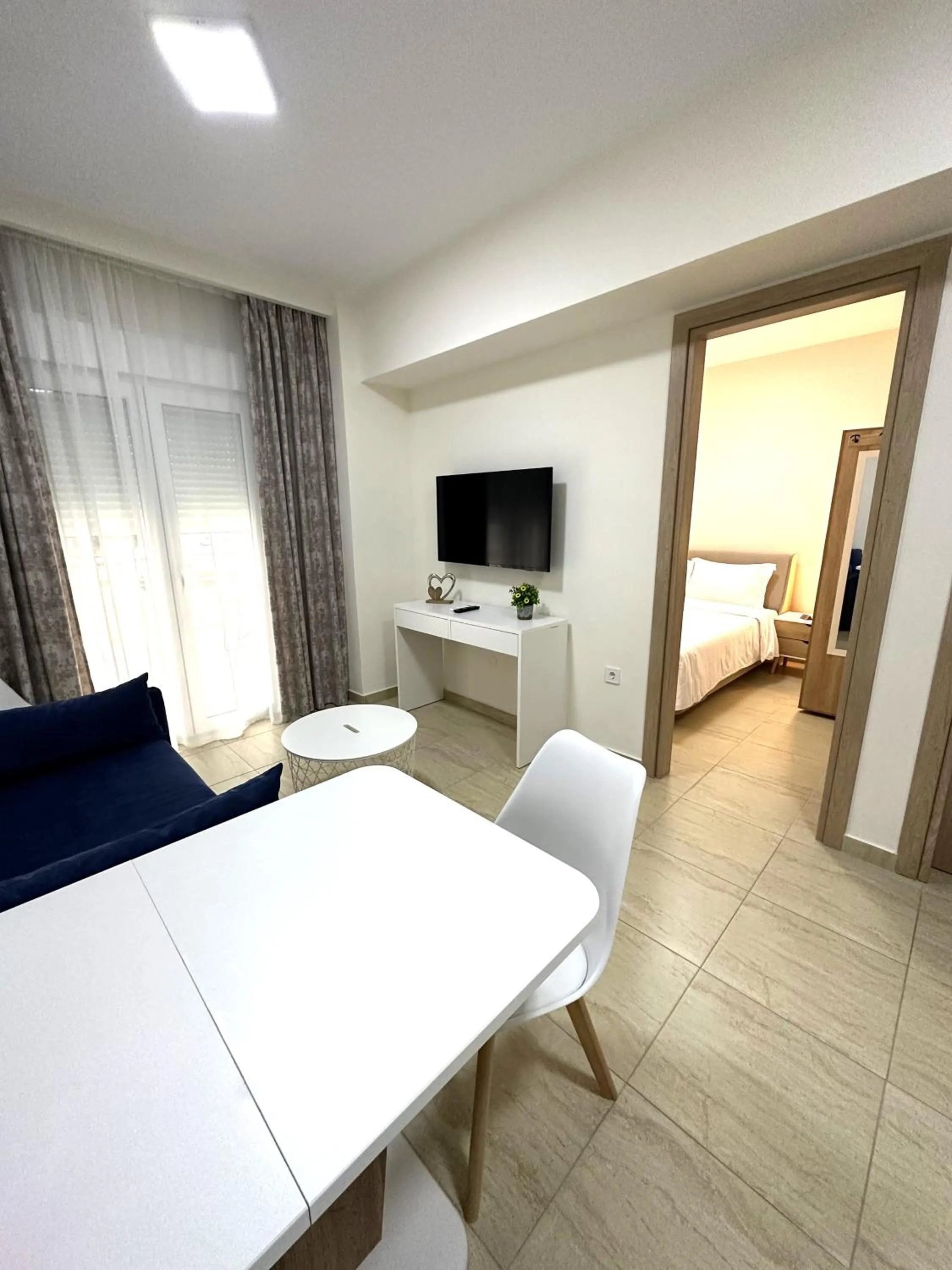 Living room, Bed in Navarino Luxe Suites