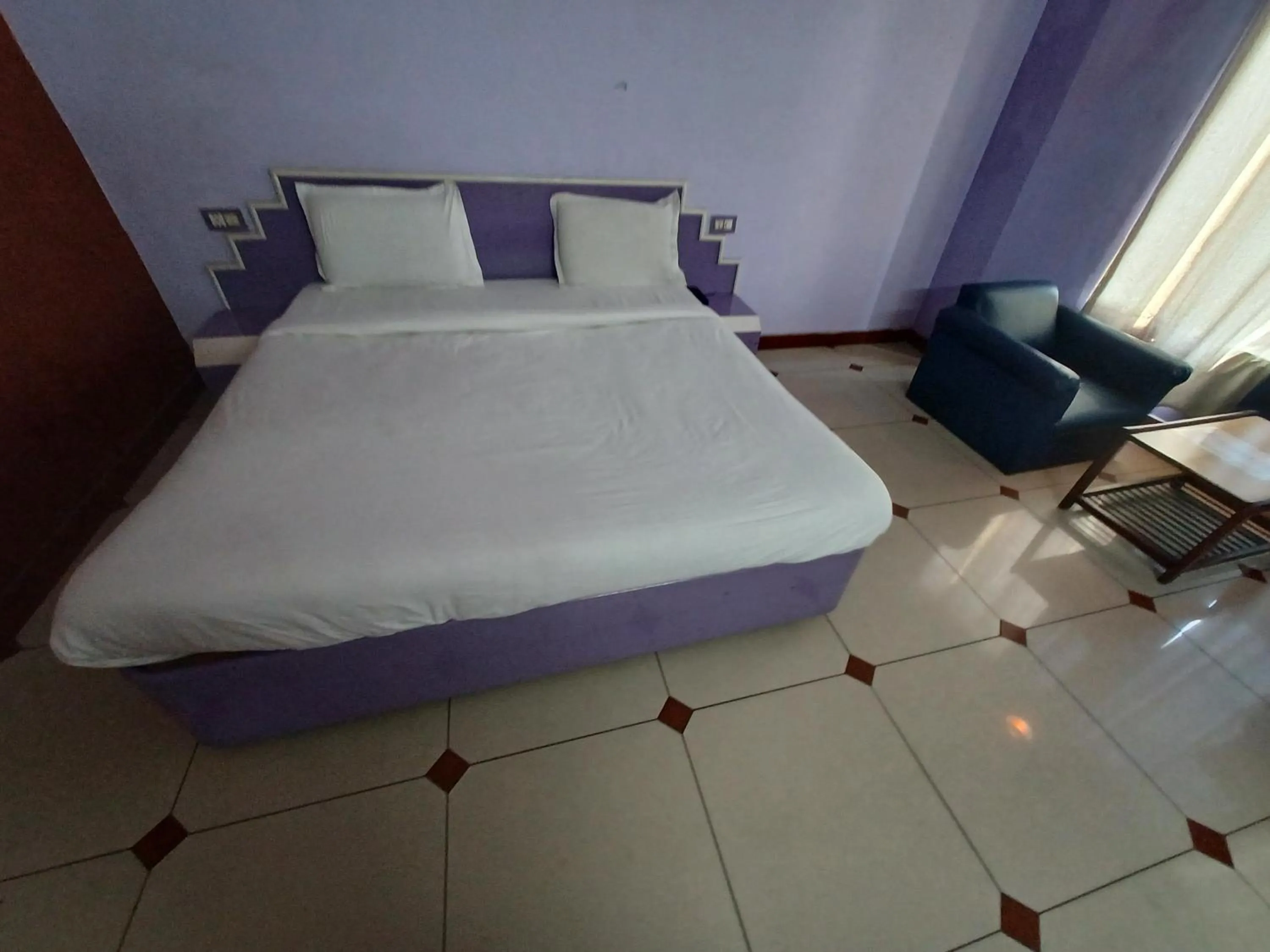 Bed in Hotel Maya international