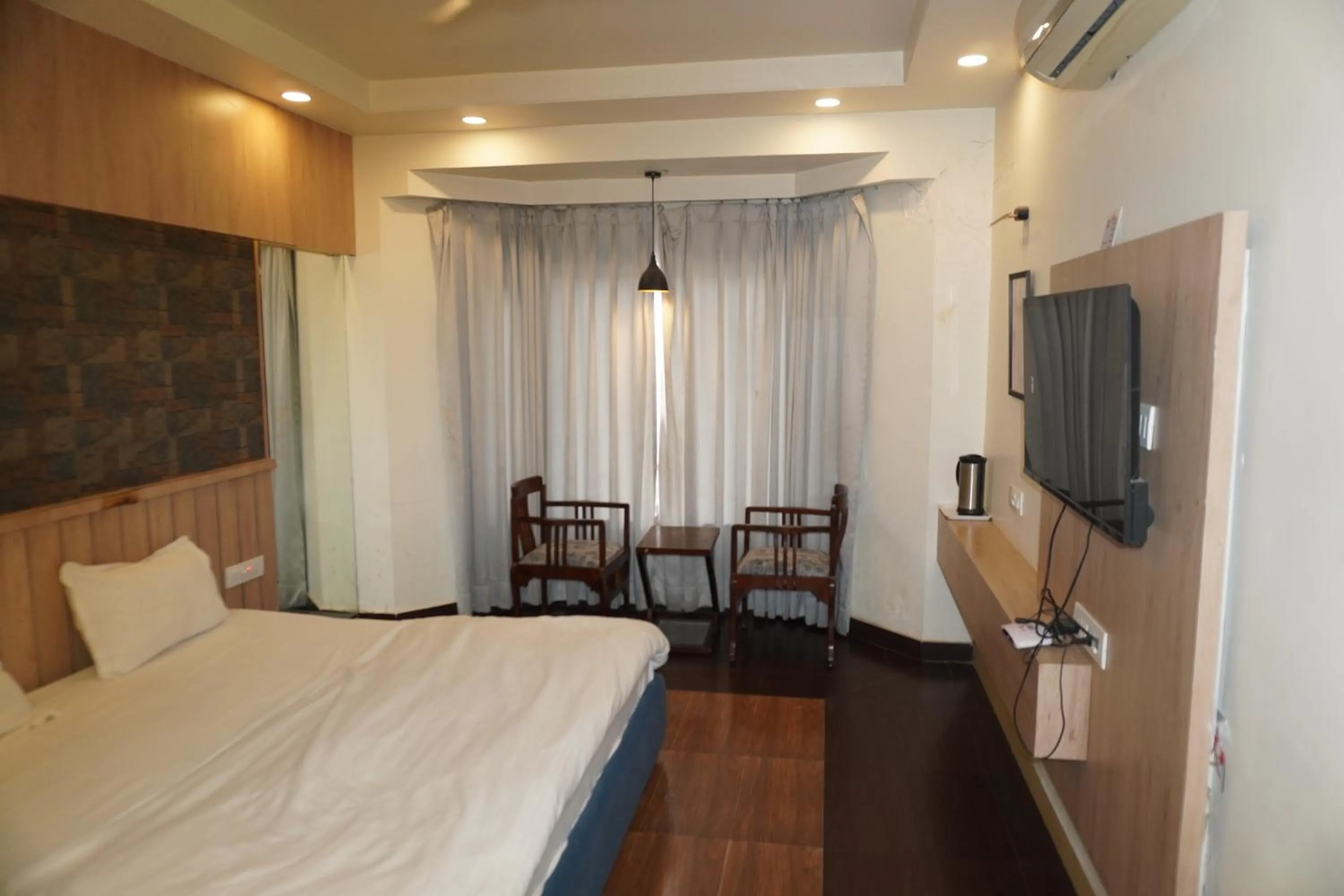 Bed in Hotel Maya international