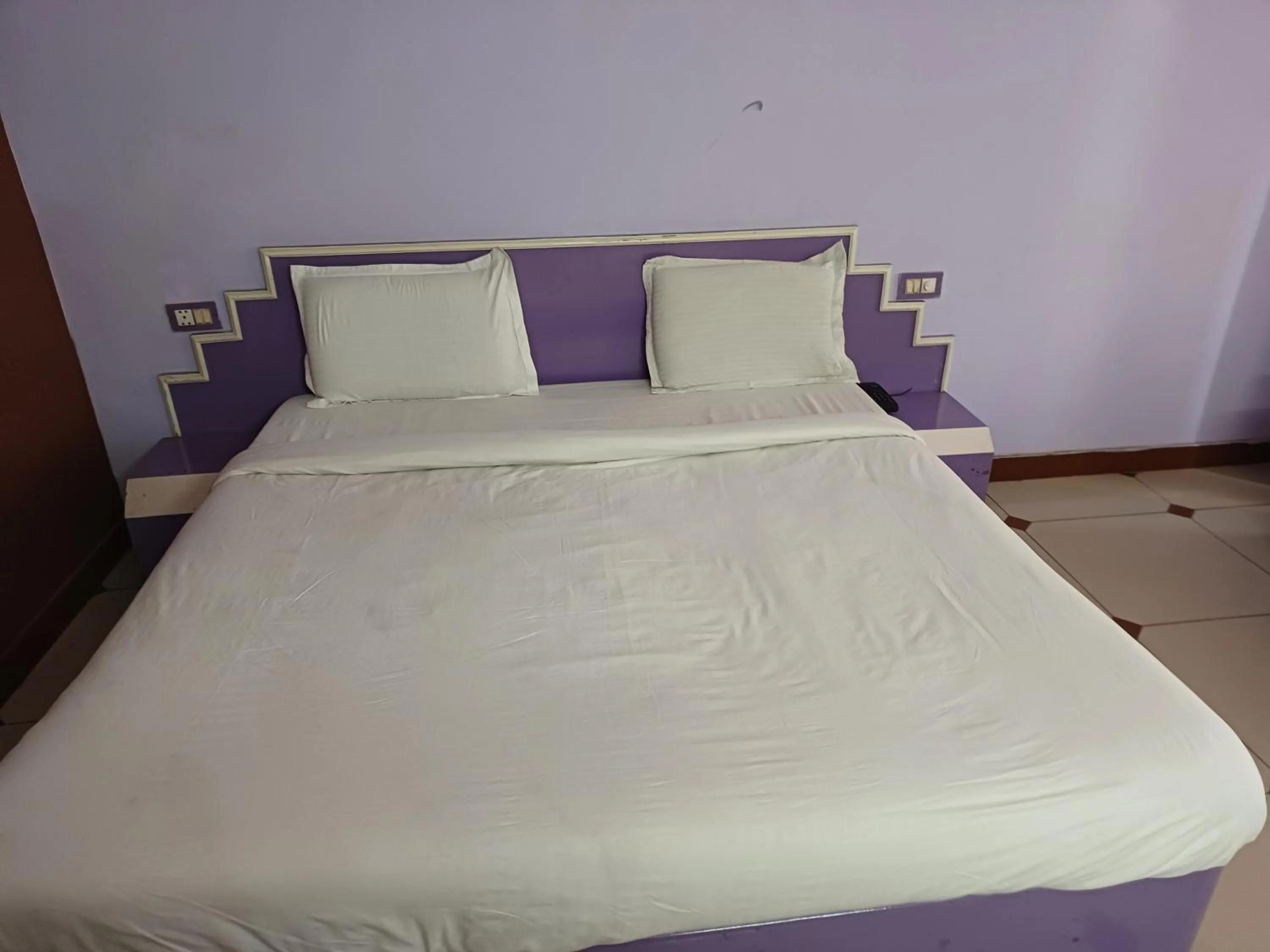 Bed in Hotel Maya international