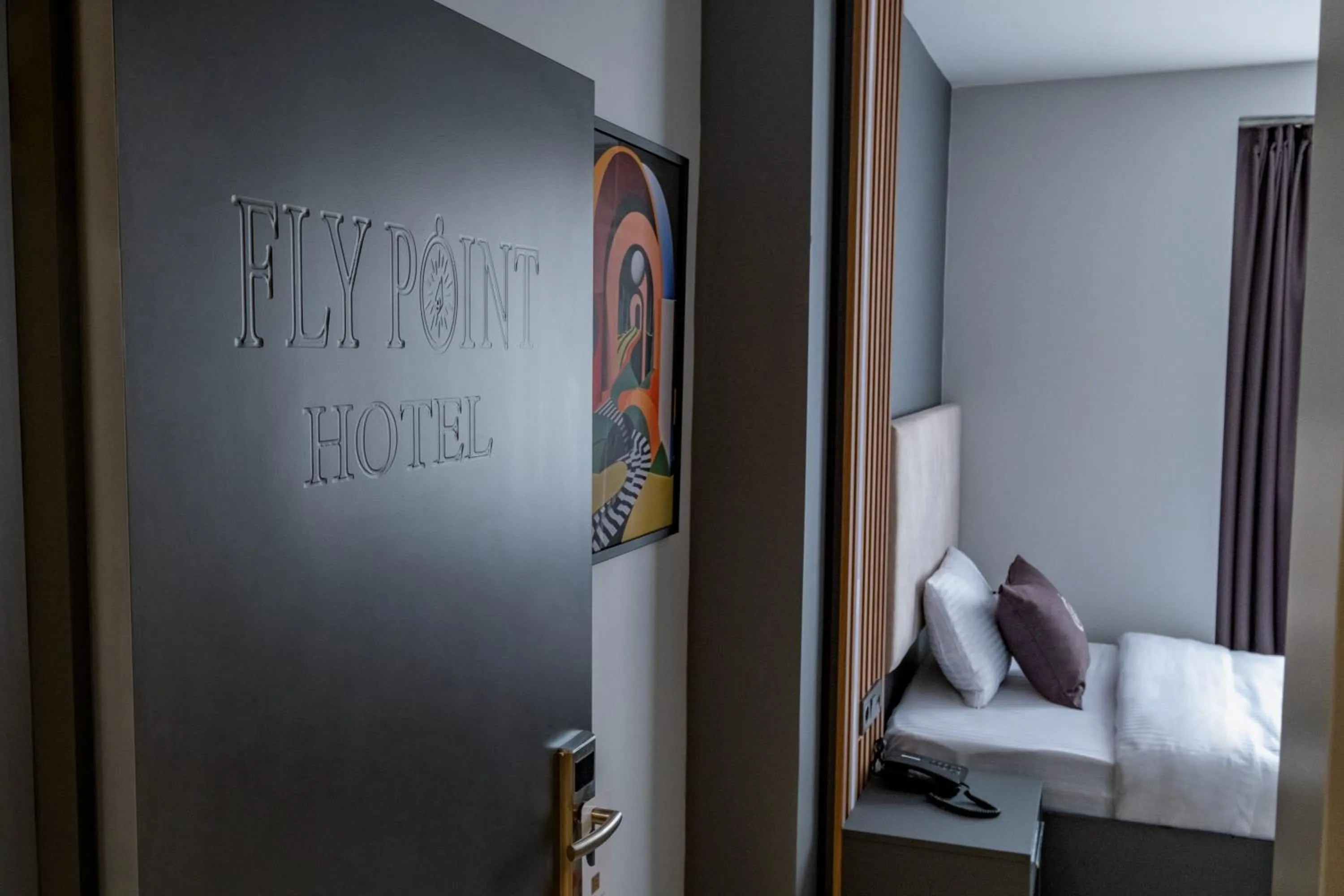 Bed in FLY POINT AIRPORT HOTEL