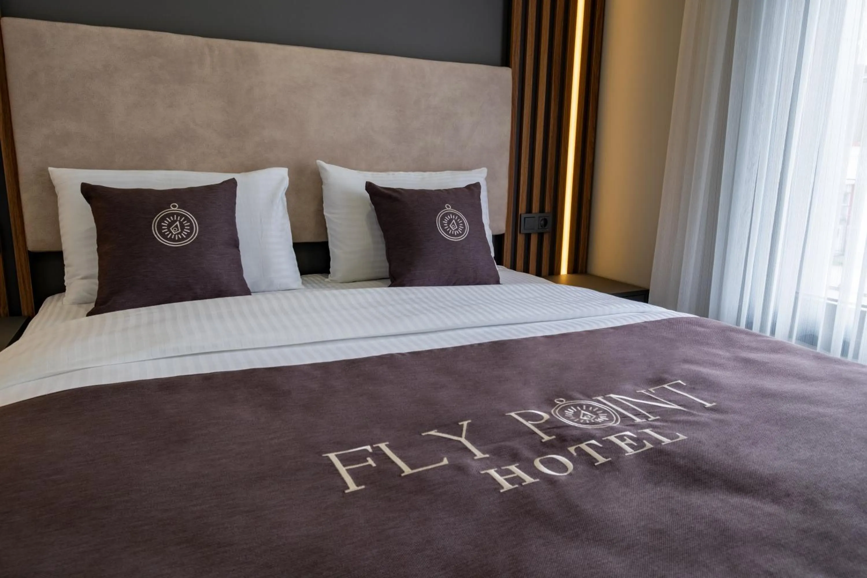 Bed in FLY POINT AIRPORT HOTEL