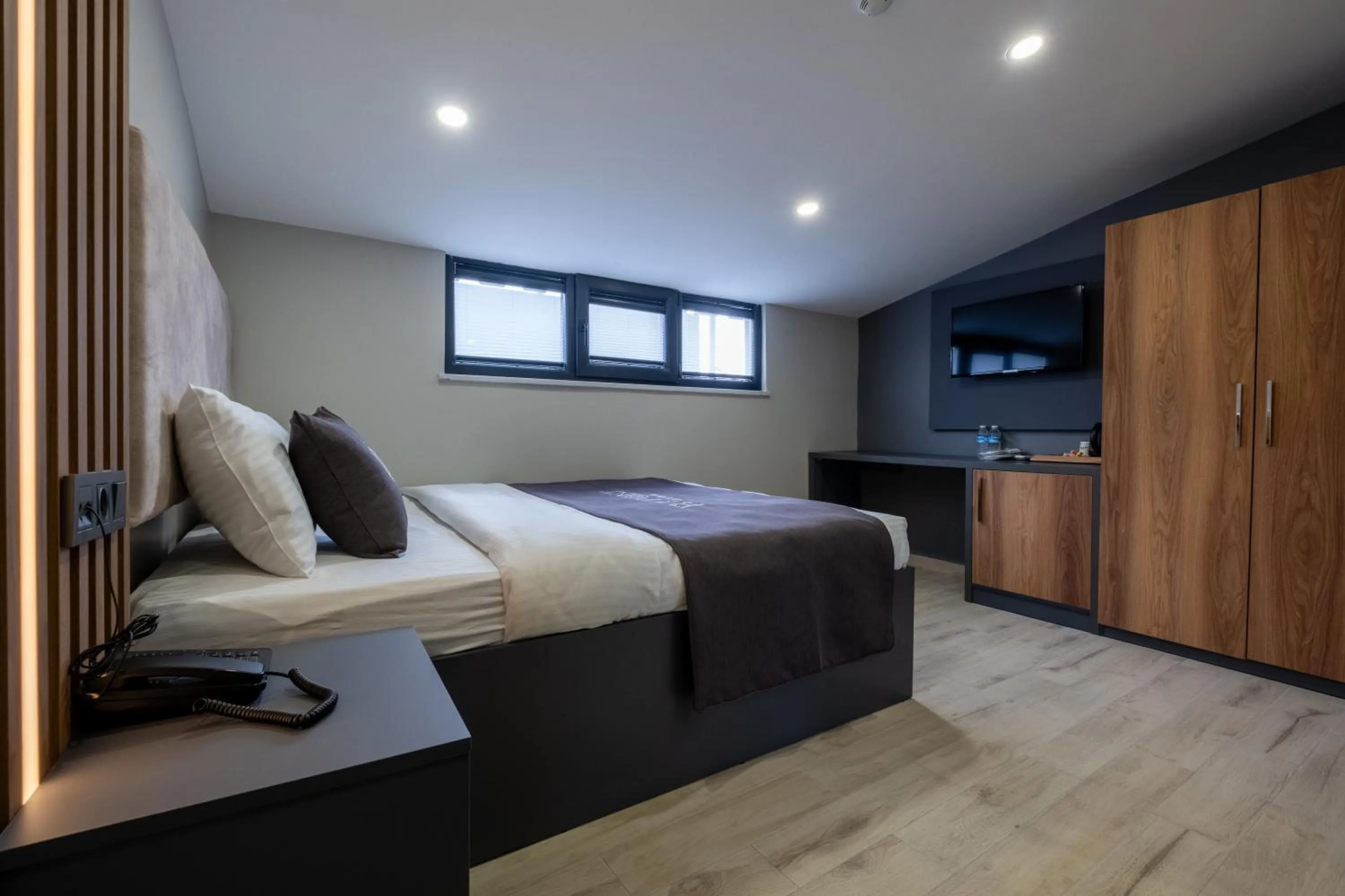 Bed in FLY POINT AIRPORT HOTEL