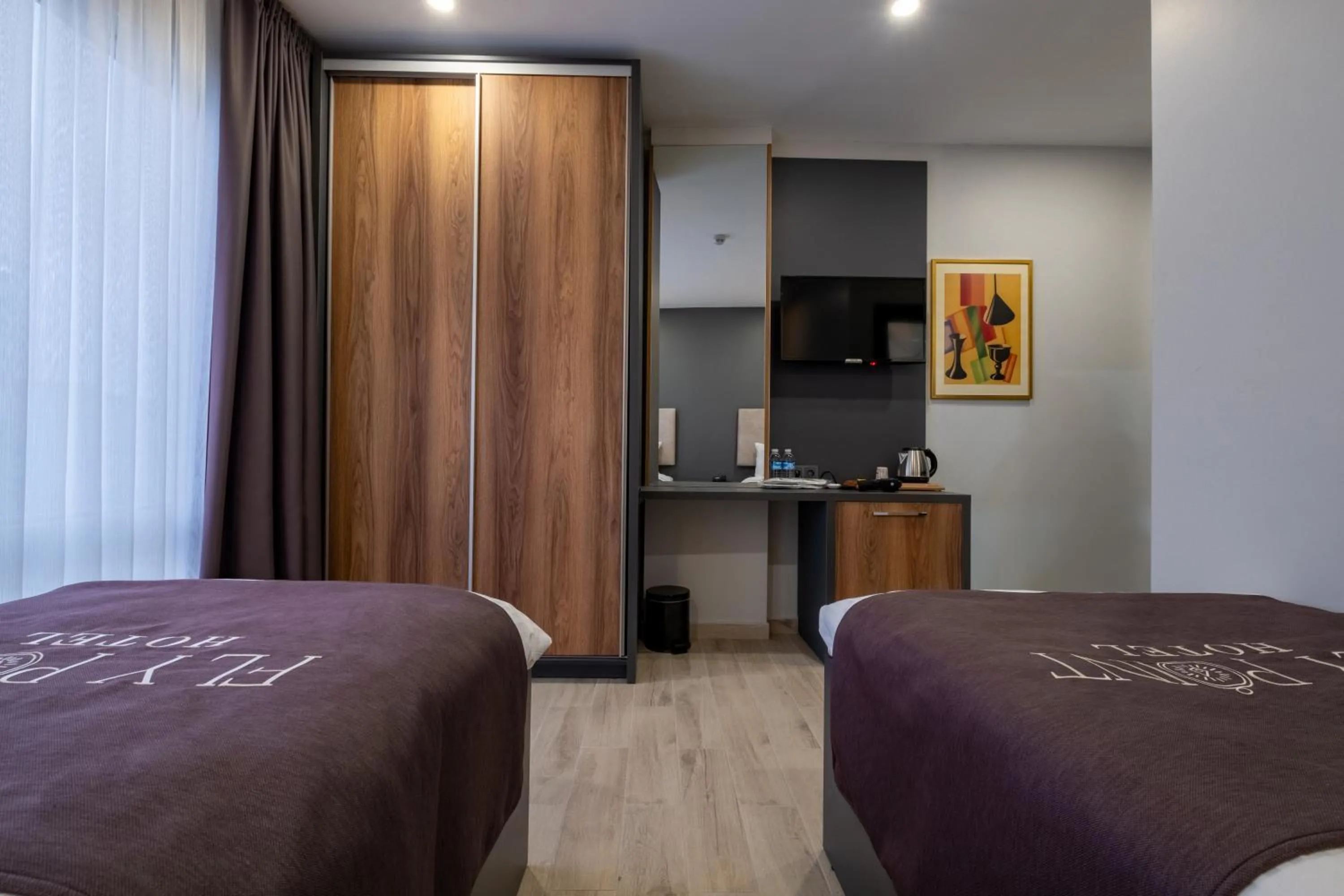 Bed in FLY POINT AIRPORT HOTEL