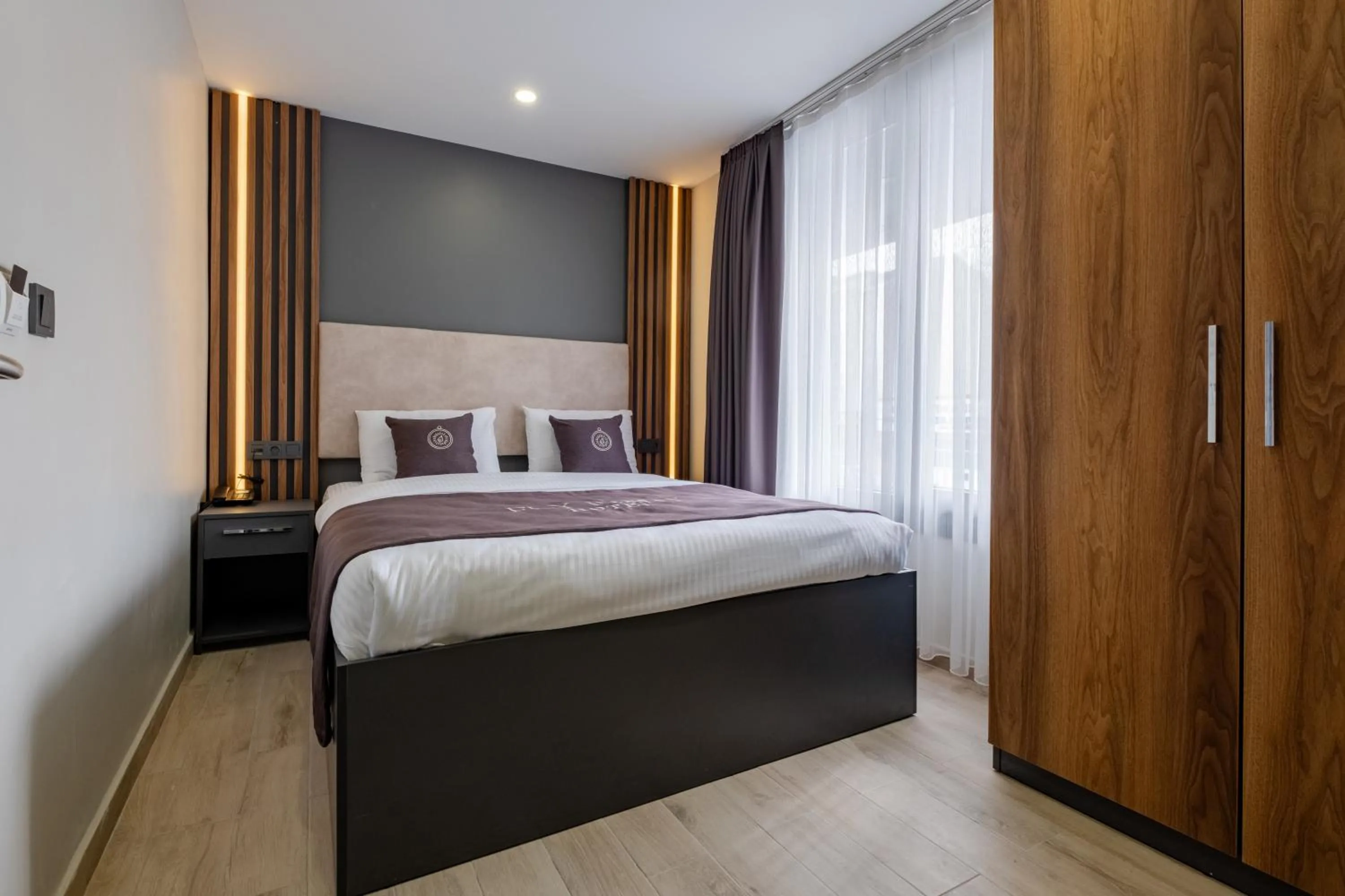 Bed in FLY POINT AIRPORT HOTEL