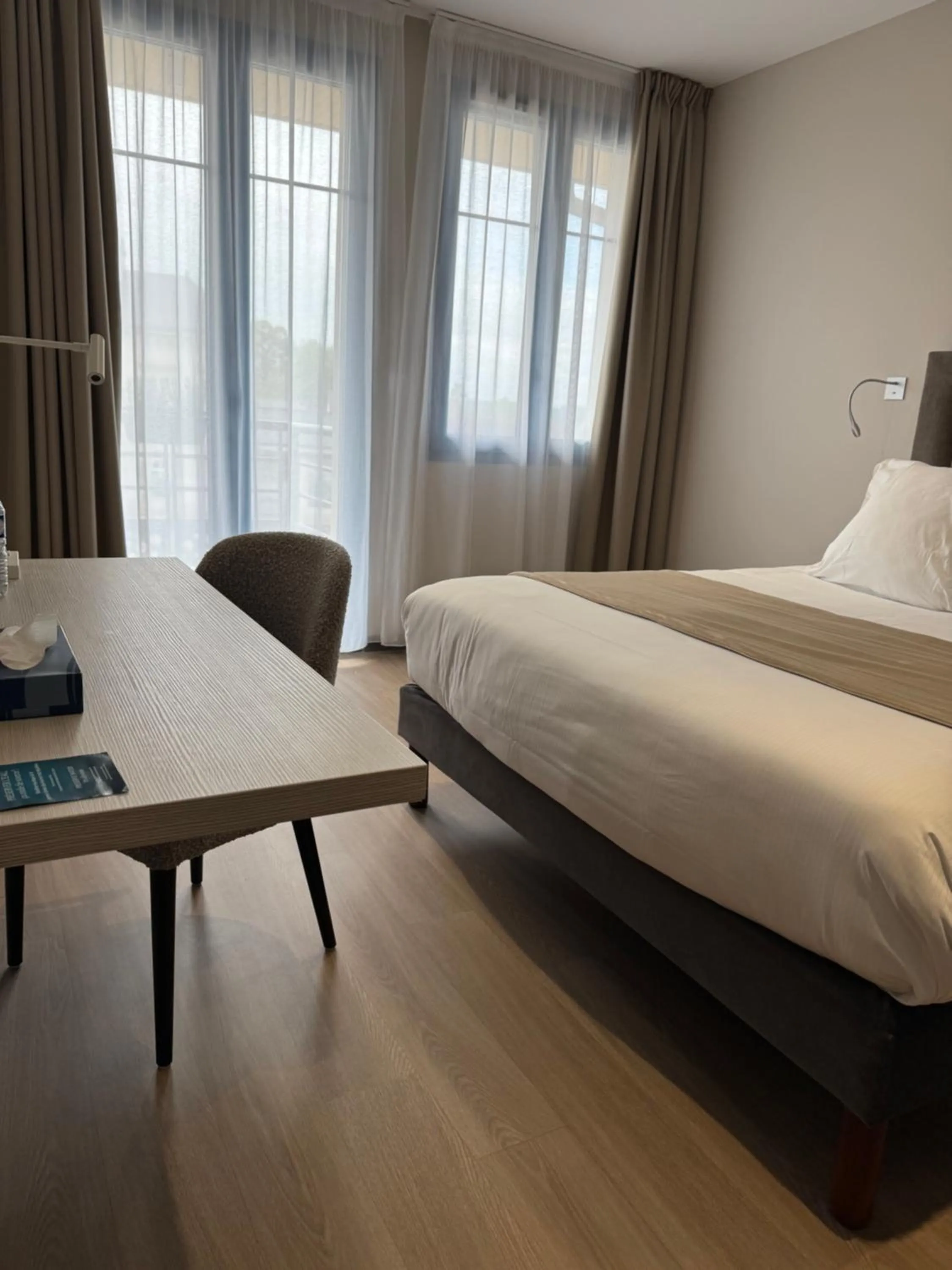 Bed in Hôtel du Commerce-restaurant au Couteau