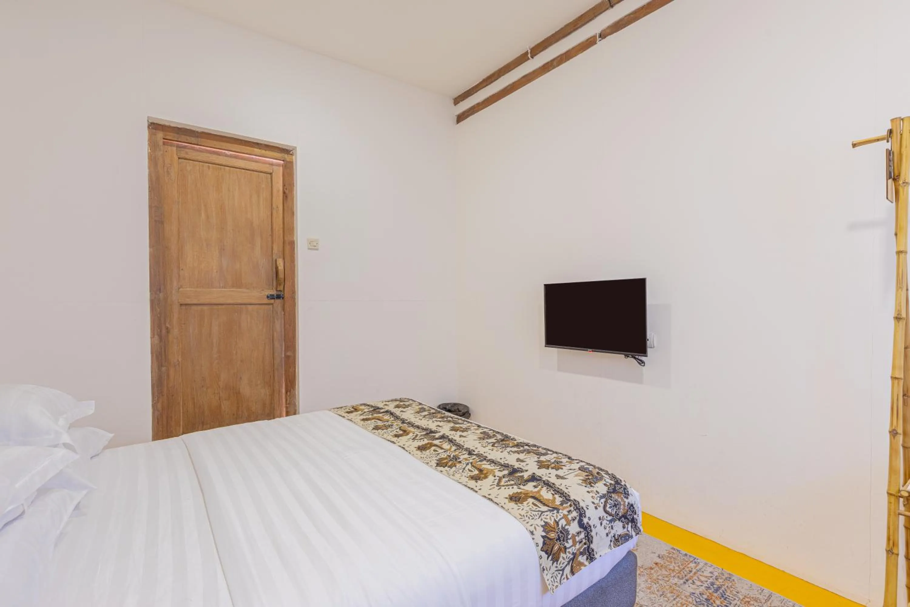 Bed in Yukke Tembi Homestay