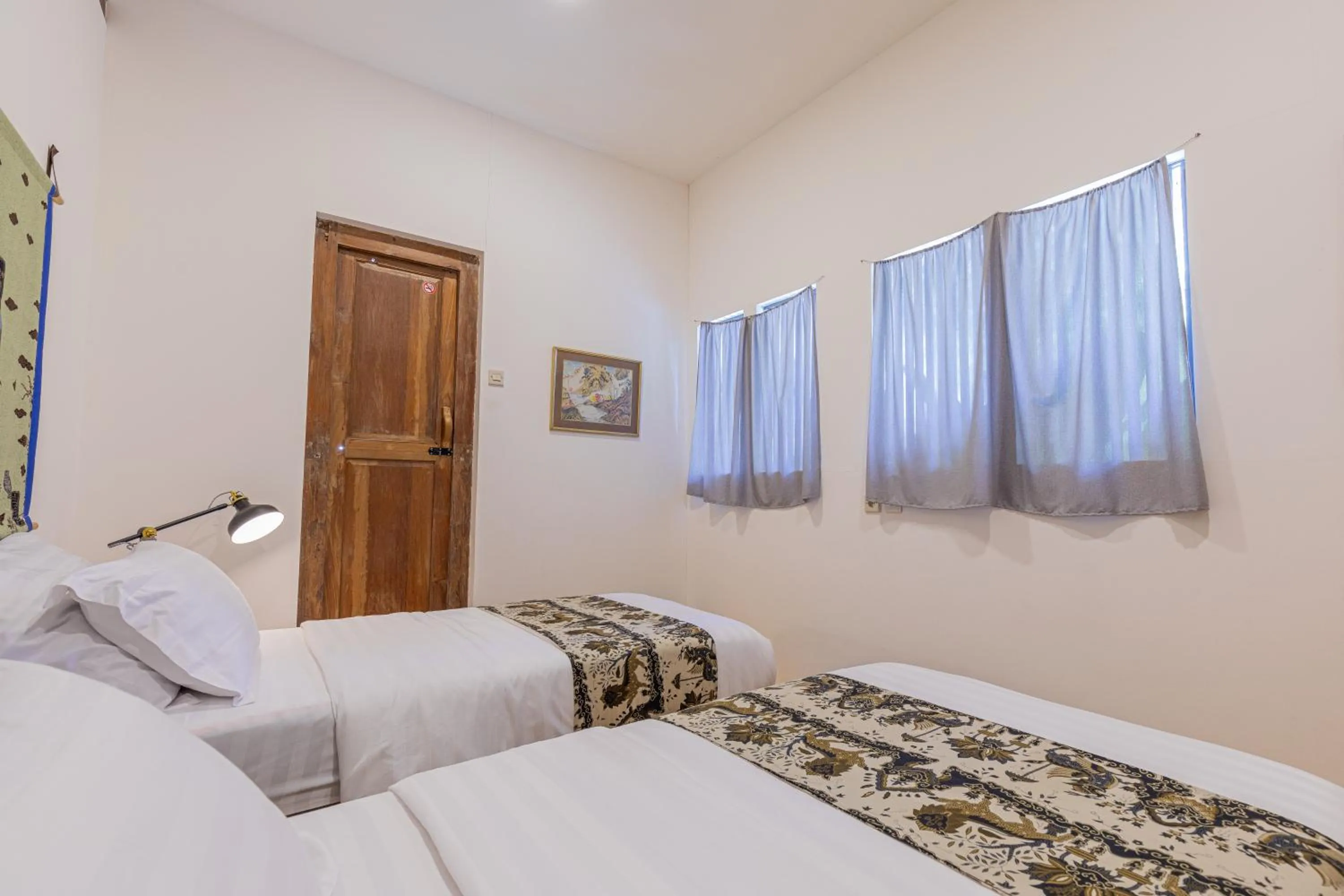 Bed in Yukke Tembi Homestay