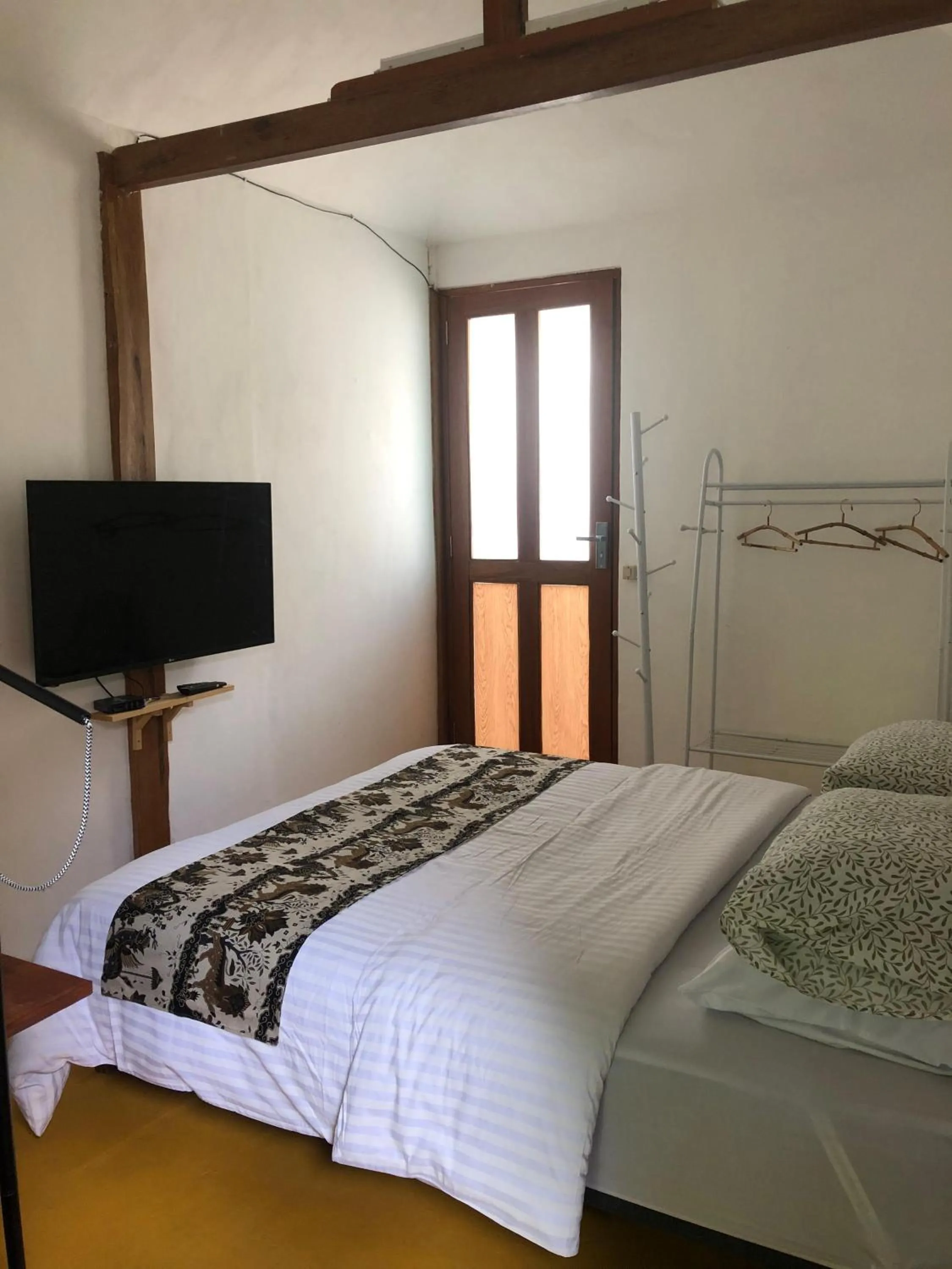 Bed in Yukke Tembi Homestay