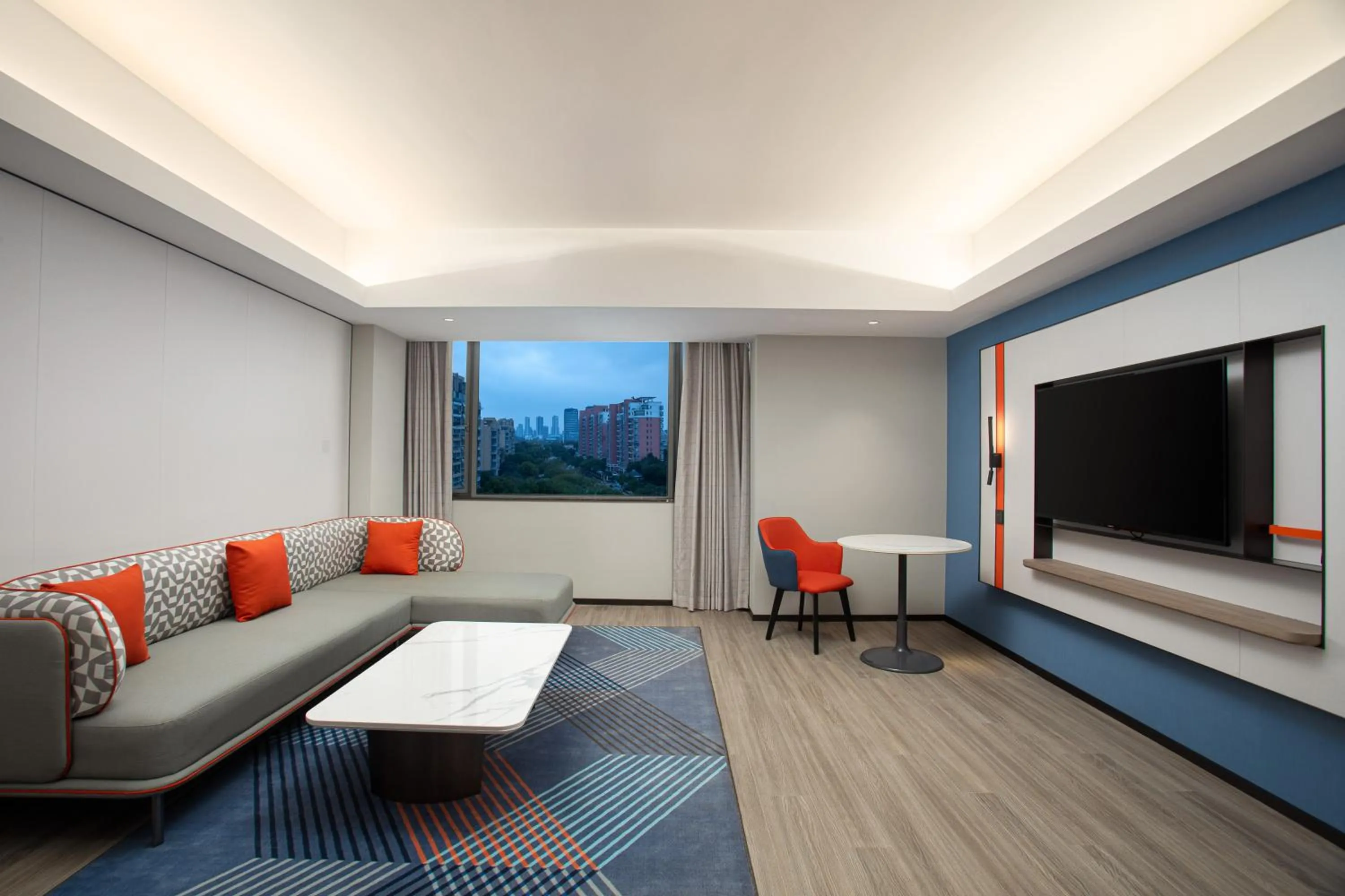 Living room in Holiday Inn Express Shanghai Gumei by IHG