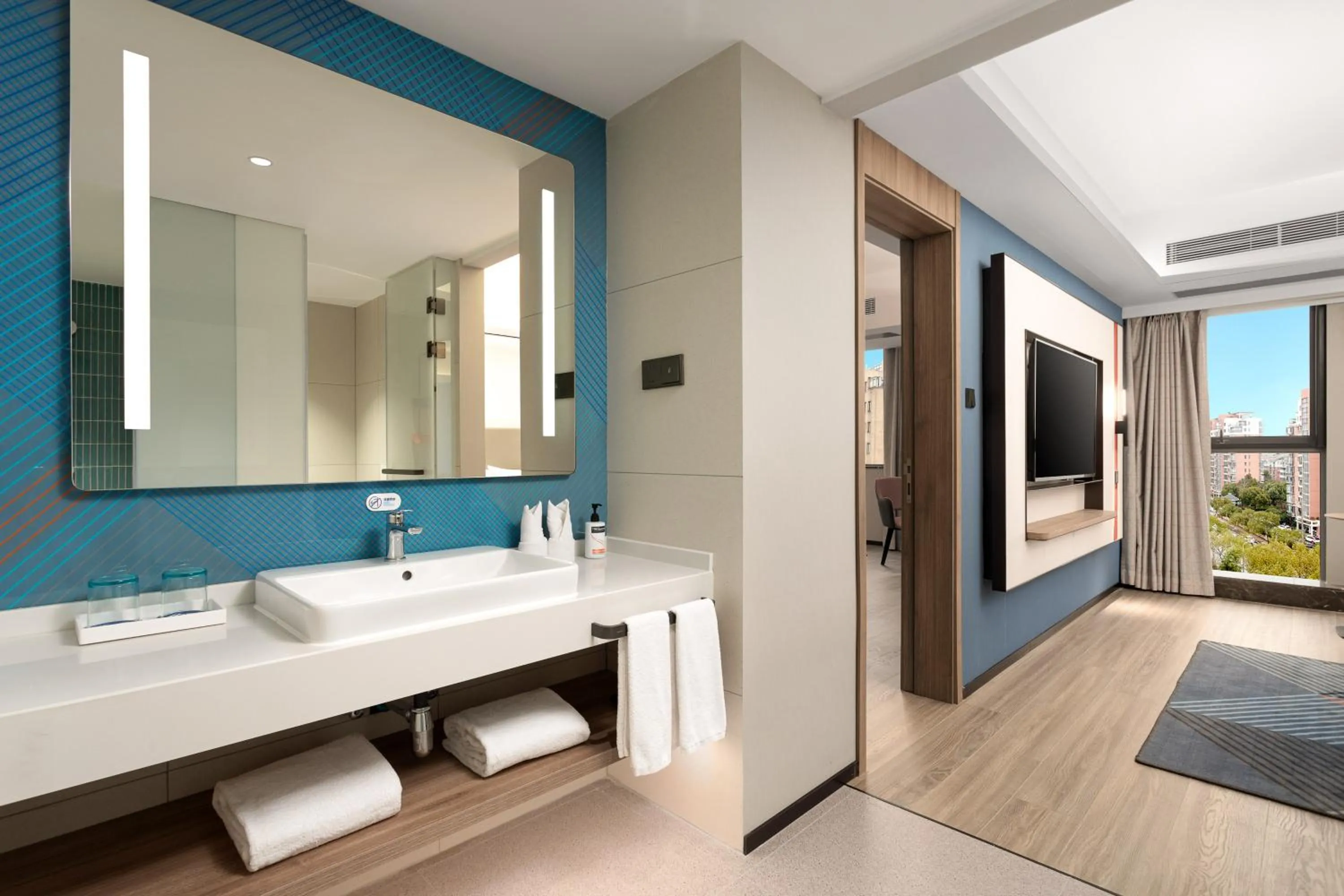 Toilet in Holiday Inn Express Shanghai Gumei by IHG