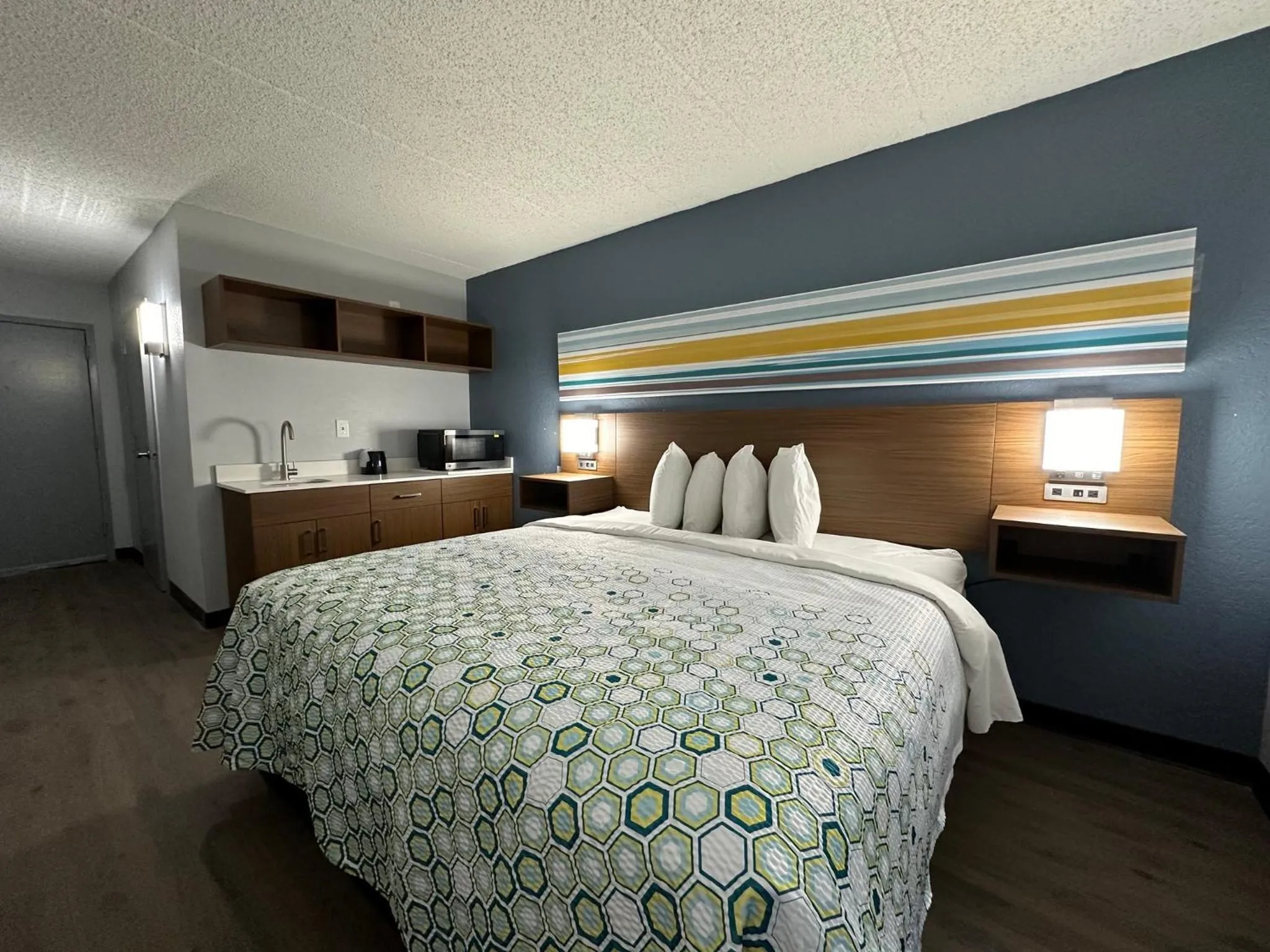 Bedroom, Bed in HomeTowne Studios by Red Roof Richmond, VA - W Broad St