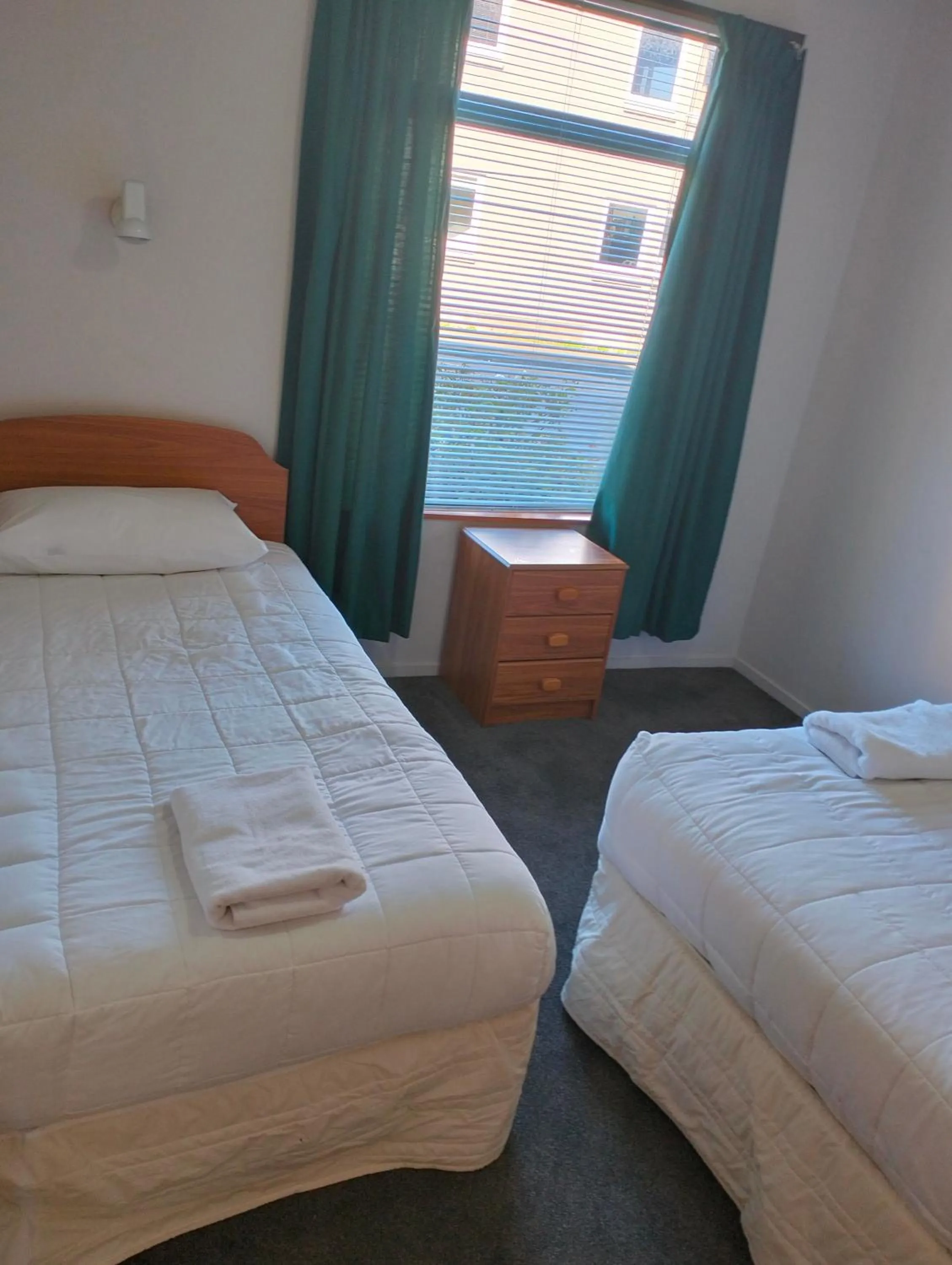 Bed in Akaroa Village Inn