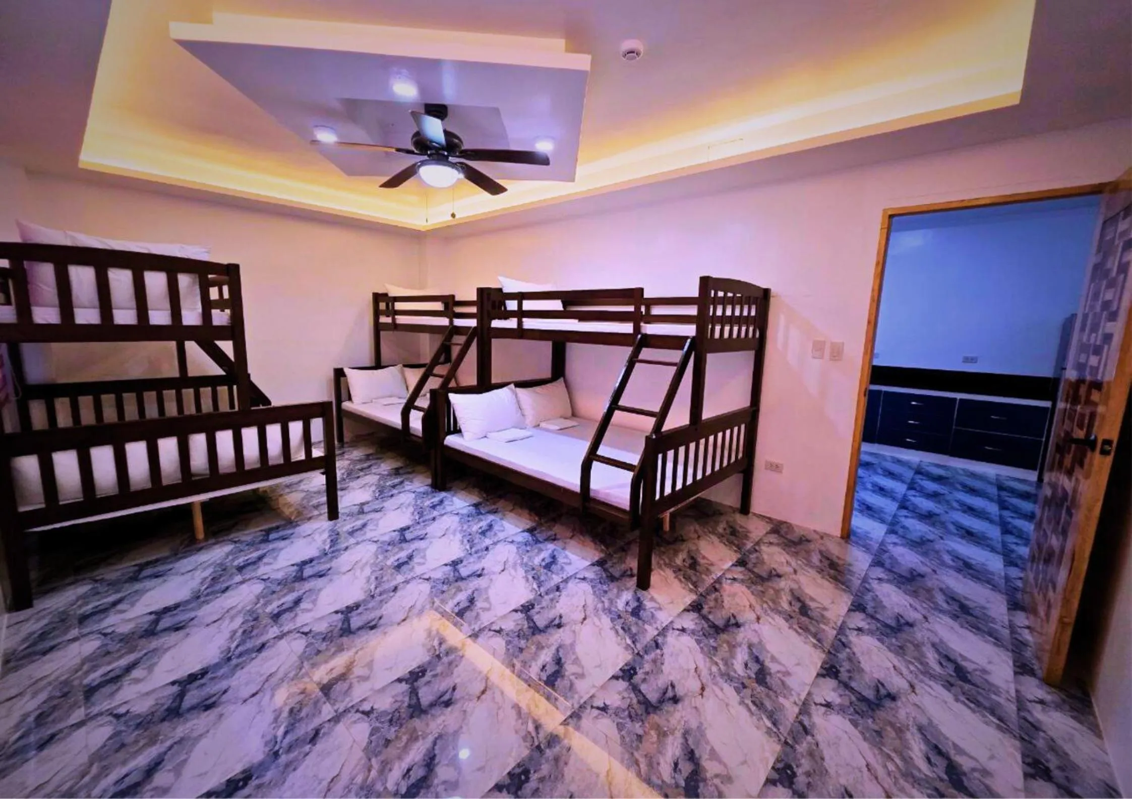 Bed in The Blessed Purple Bamboo Beach Resort