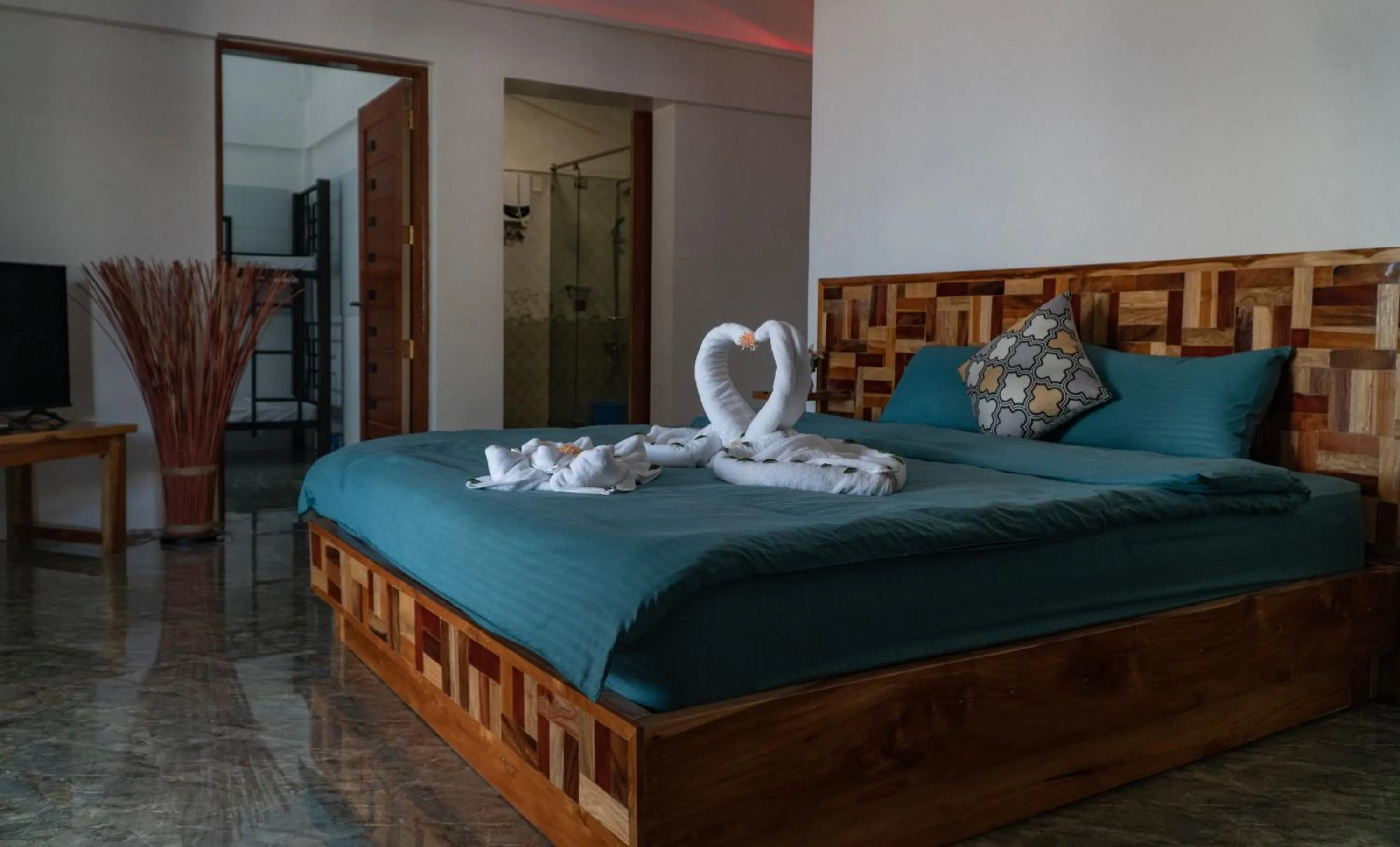 Bed in The Blessed Purple Bamboo Beach Resort