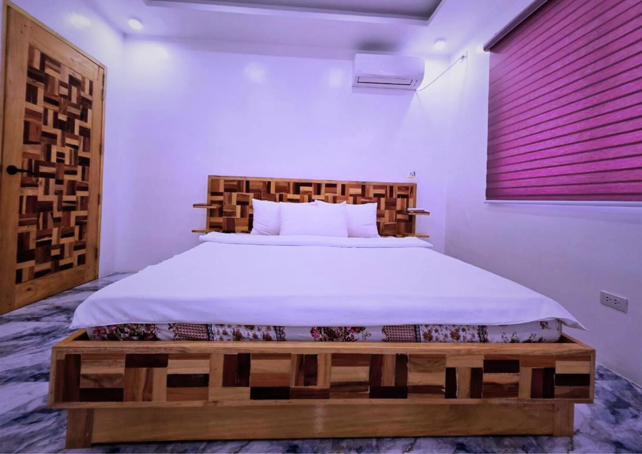 Bed in The Blessed Purple Bamboo Beach Resort